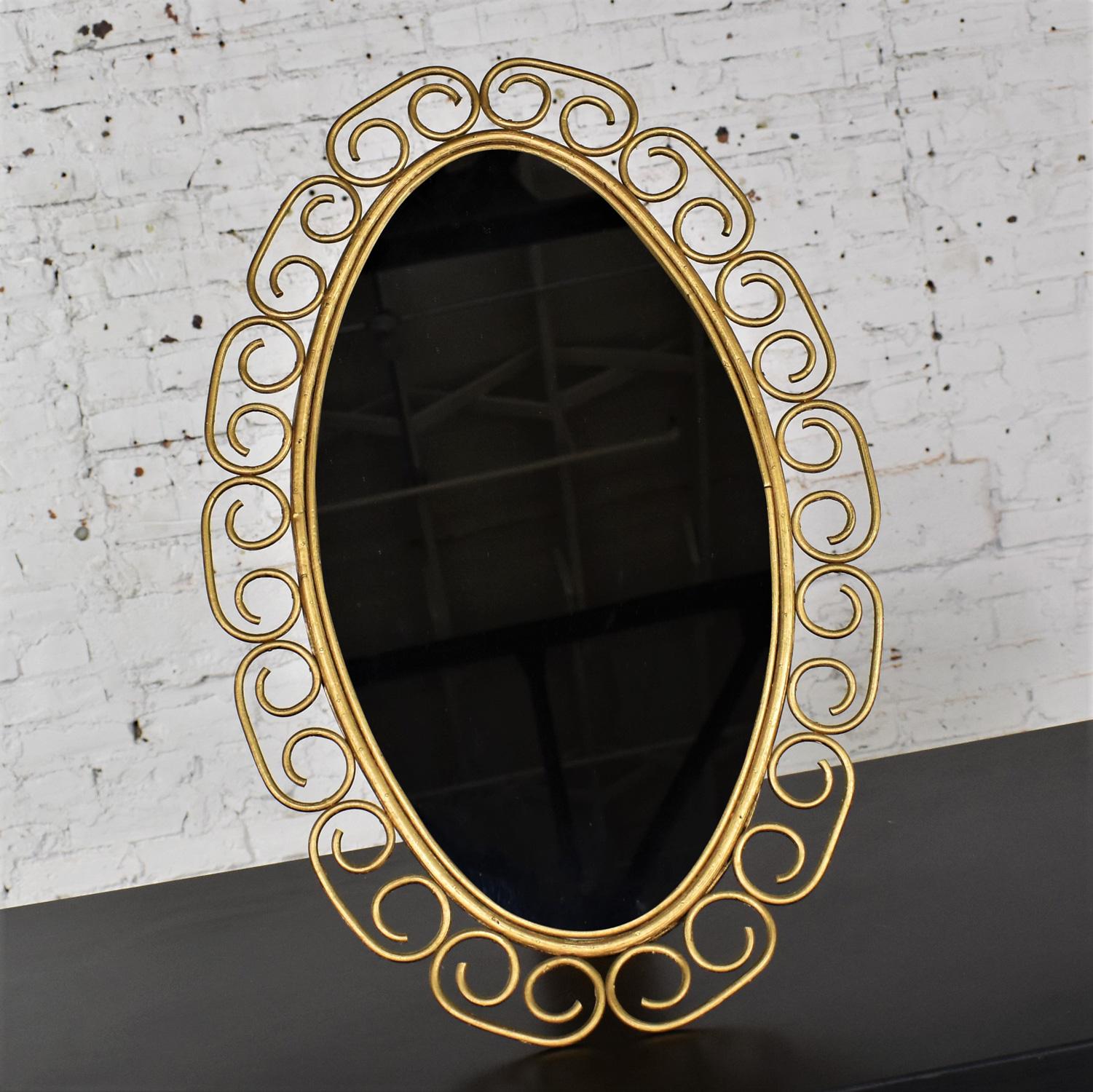 1960-1970’s Hollywood Regency Bohemian Free Standing Mirror Gold Painted Wicker  In Good Condition For Sale In Topeka, KS