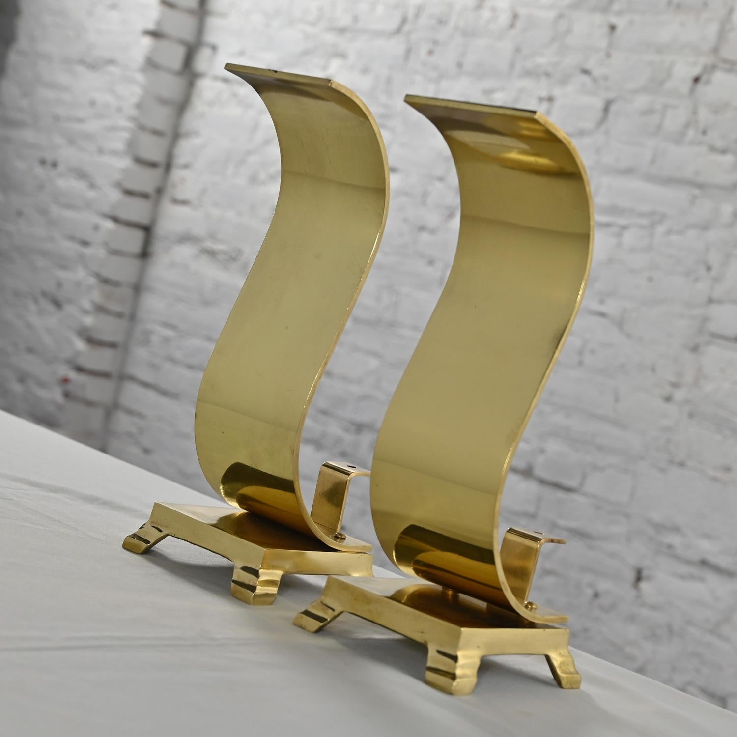 Handsome vintage MCM or Mid-Century Modern to Modern Andirons or Firedogs comprised of solid brass wave, scroll, or S shaped. Beautiful condition, keeping in mind that these are vintage and not new so will have signs of use and wear. They have been