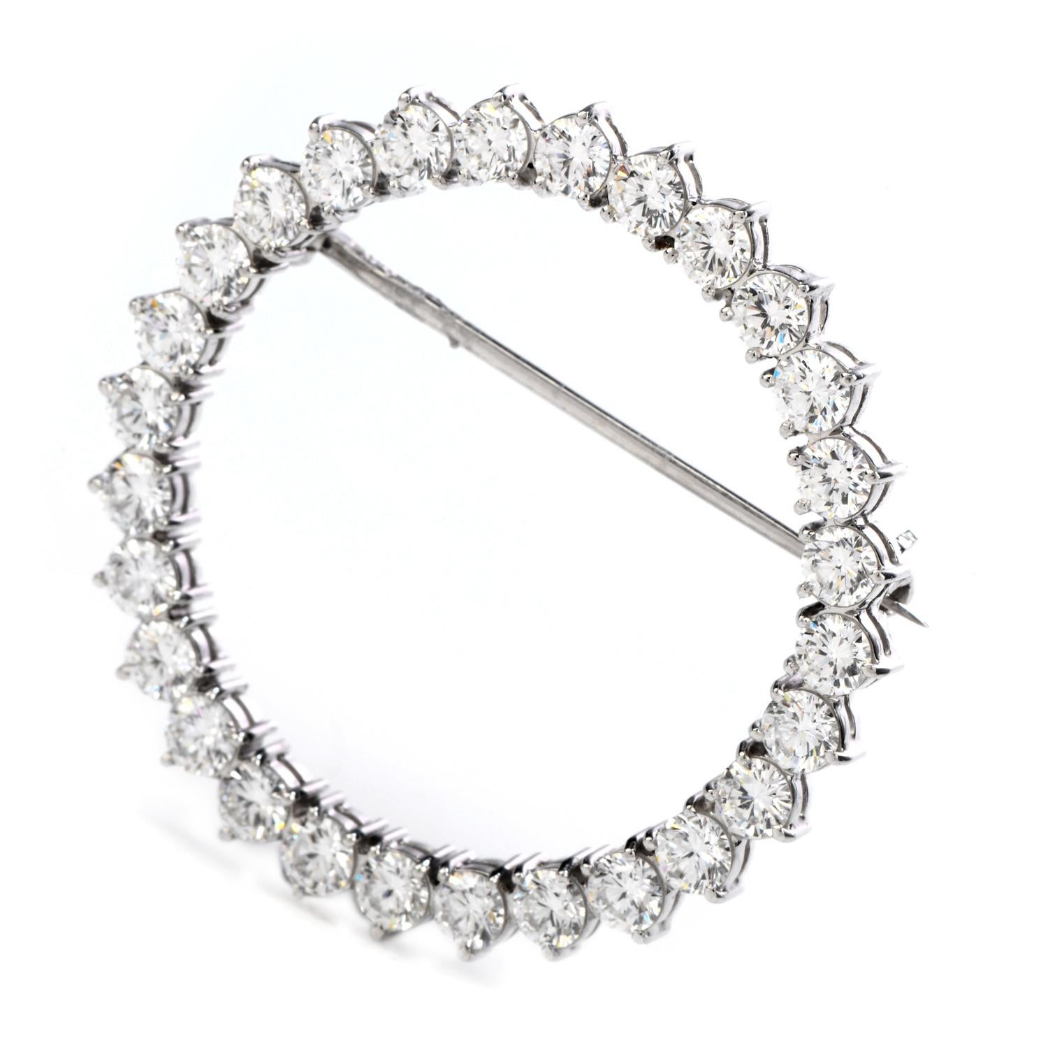 Bright and dazzling with this vintage 1960's diamond & platinum brooch, wreath inspired with a circular shape.

Crafted in solid platinum, composed by 28 round-cut, prong set, Diamonds weighing approximately 3.00 carats F-G color and VS clarity

The