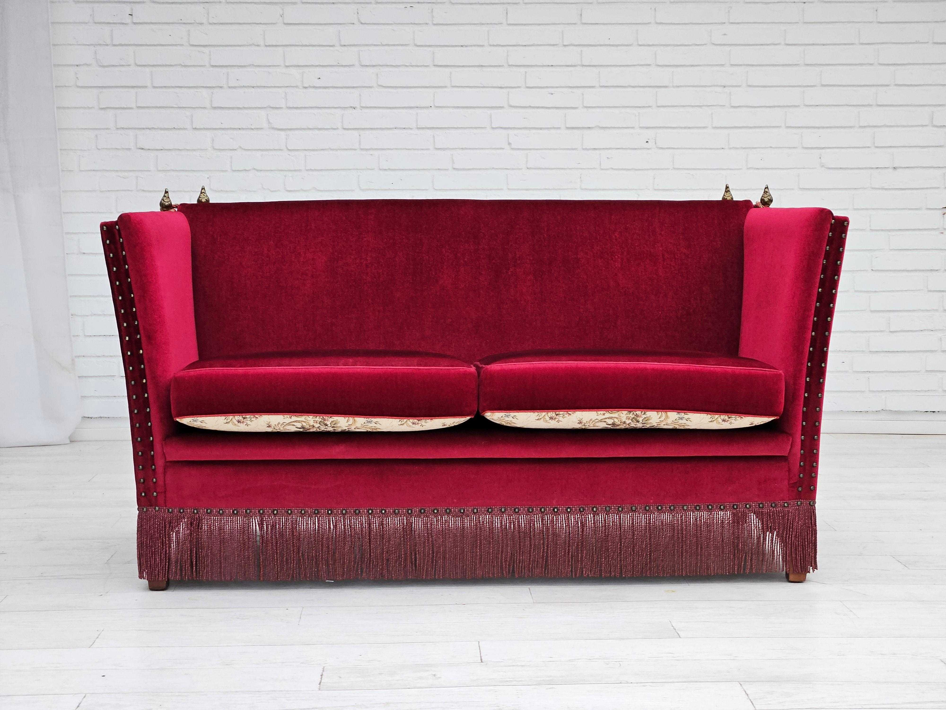 1960s, Danish 2 seater sofa in original very good condition: no smells and no stains. Cherry-red velour and beige furniture fabric. Removable double-sided seat cushions. Manufactured by Danish furniture manufacturer in about 1960s. Beech wood legs.