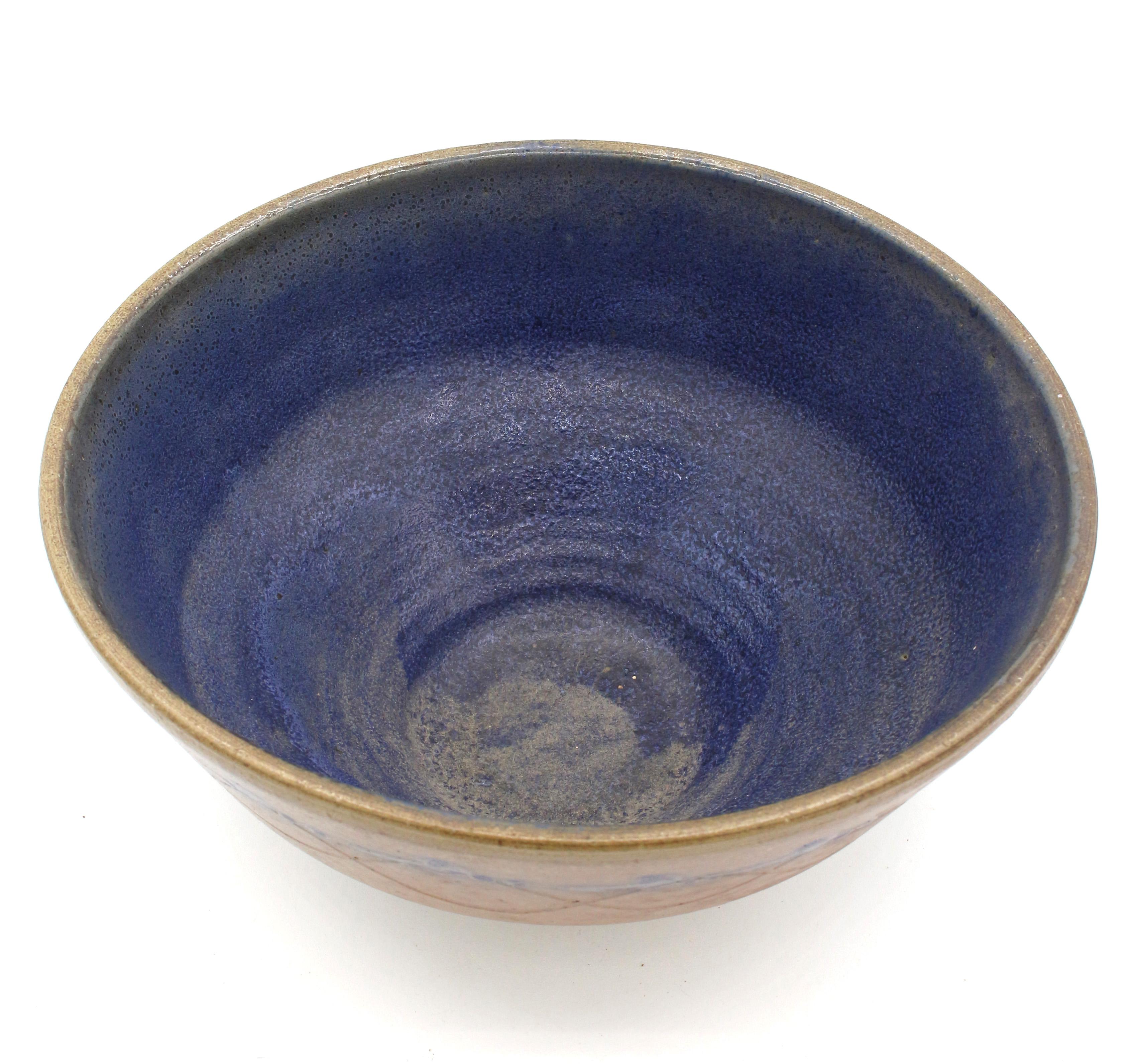 1960-72 Ben Owen, Master Potter, large fruit bowl. Known variously as Ben Owen I or Senior, he was the second known potter to work at Jugtown Pottery in 1923. Brown with royal blue interior and decoration. This decoration & form continues through