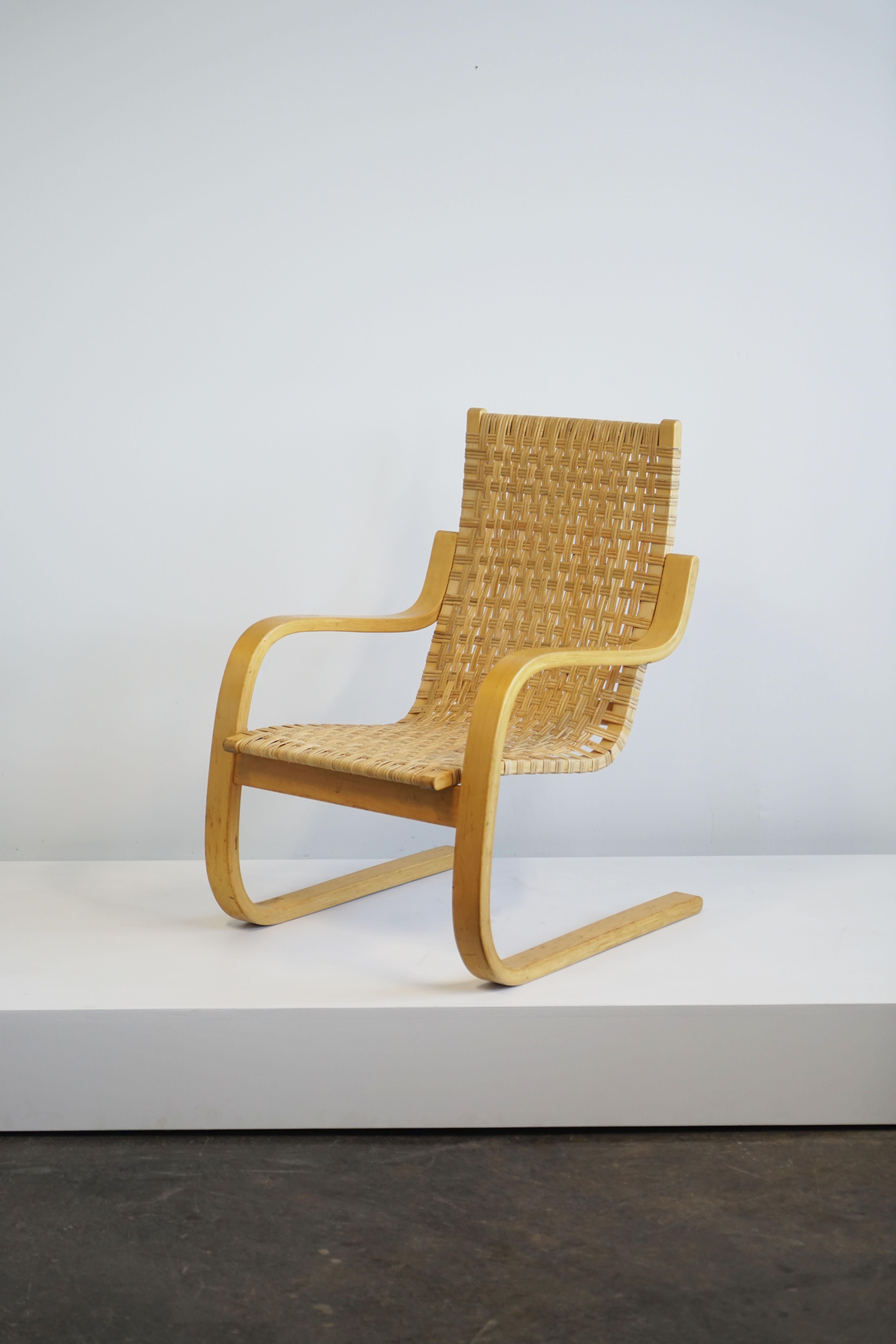 Alvar Aalto, cantilevered chair model 406. 
Laminated birch, cane.
circa 1960

The model 406 chair was originally designed in 1938-39. 
35