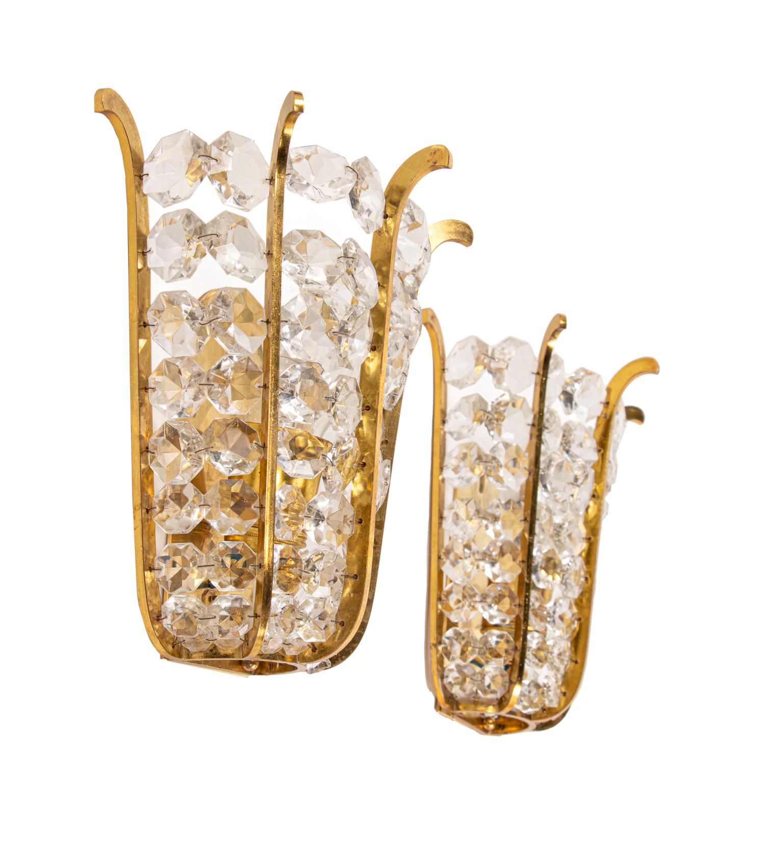 Elegant sconces with faceted crystals mounted on a brass wall frame. High quality workmanship. Manufactured by Bakalowits & Sons, Vienna, Austria in the 1960s. 
 
Measures: width 8.7