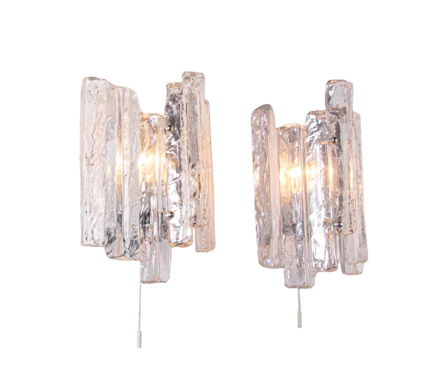 Elegant set of two hand blown Murano glass wall sconces on a nickel frame. Hanging glass resembles ice floes. Gem from the time. With this light you make a clear statement in your interior design. A real eye-catcher even unlit. Manufactured by J.T.