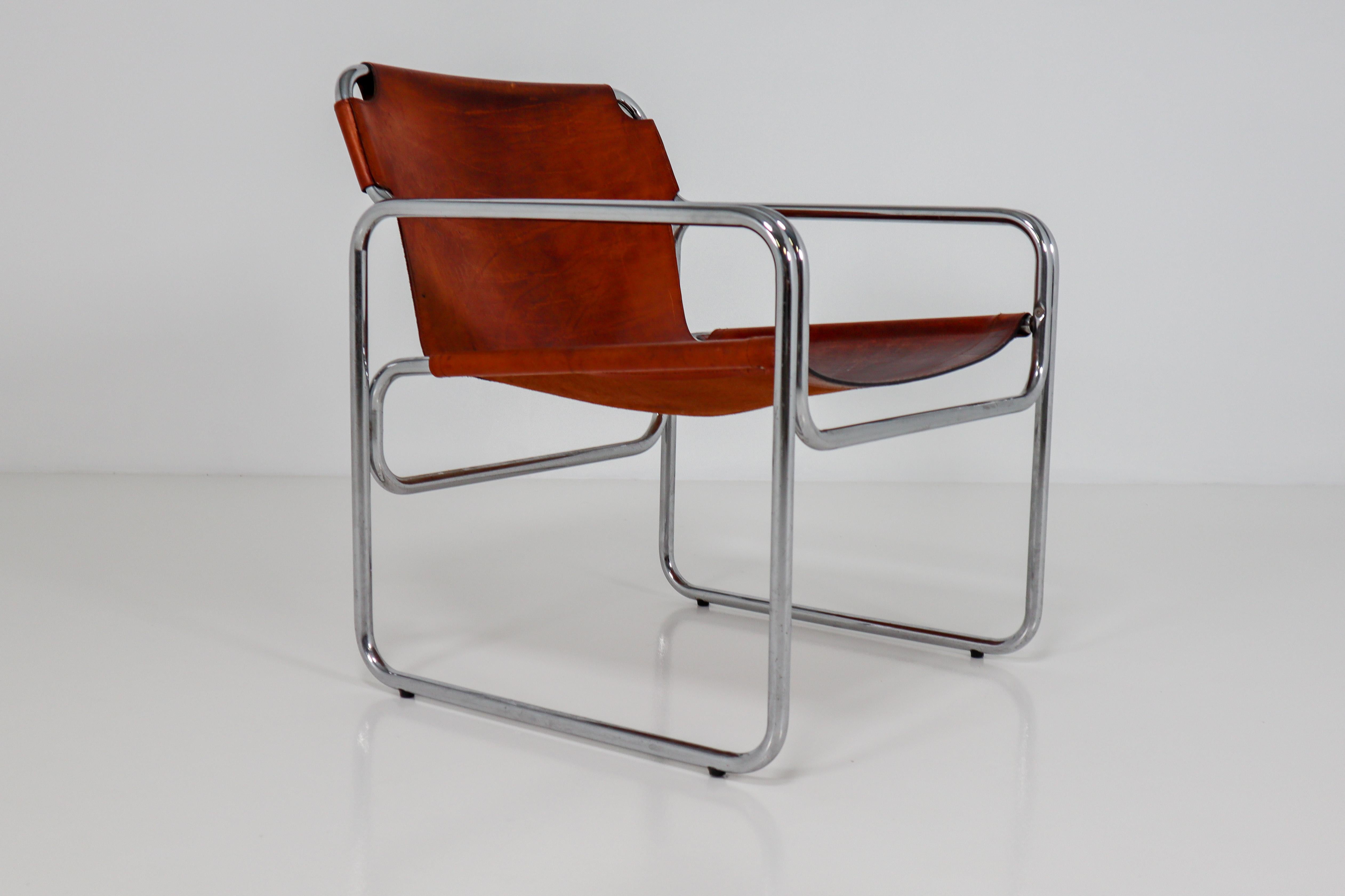 The chair is truly a great example of the radical Bauhaus aesthetic. Original, yet simple and functional, it represents the ethos of the avant-garde movement. The chair contains cognac leather in good vintage condition. This particular chair was