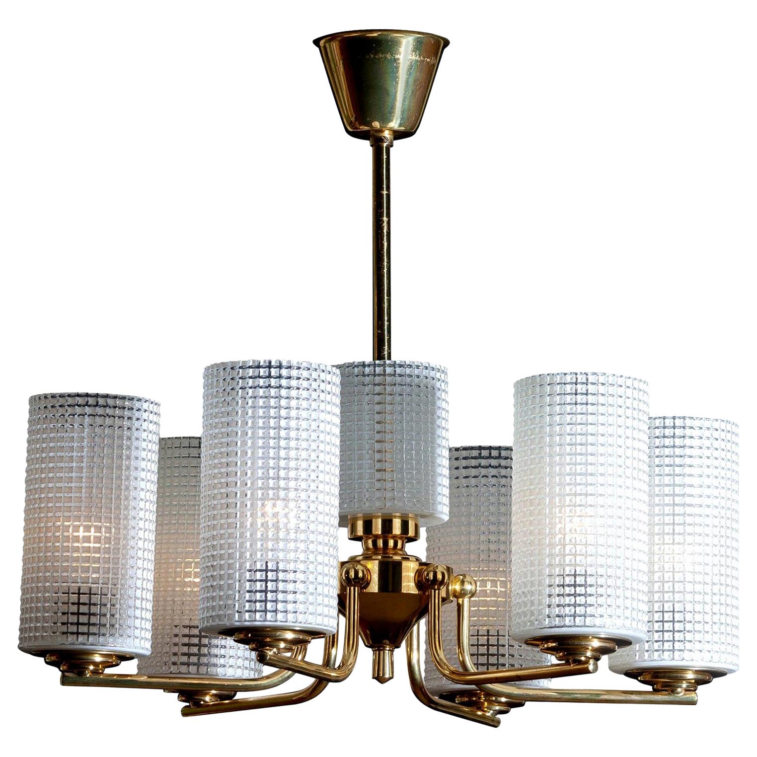 1960s, beautiful and excellent brass chandelier designed by Carl Fagerlund for Orrefors, Sweden.
The six glass vases are 18cm / 7 inch high. The one in the middle is 11cm / 4.3 inch.
The overall condition is very good.
 