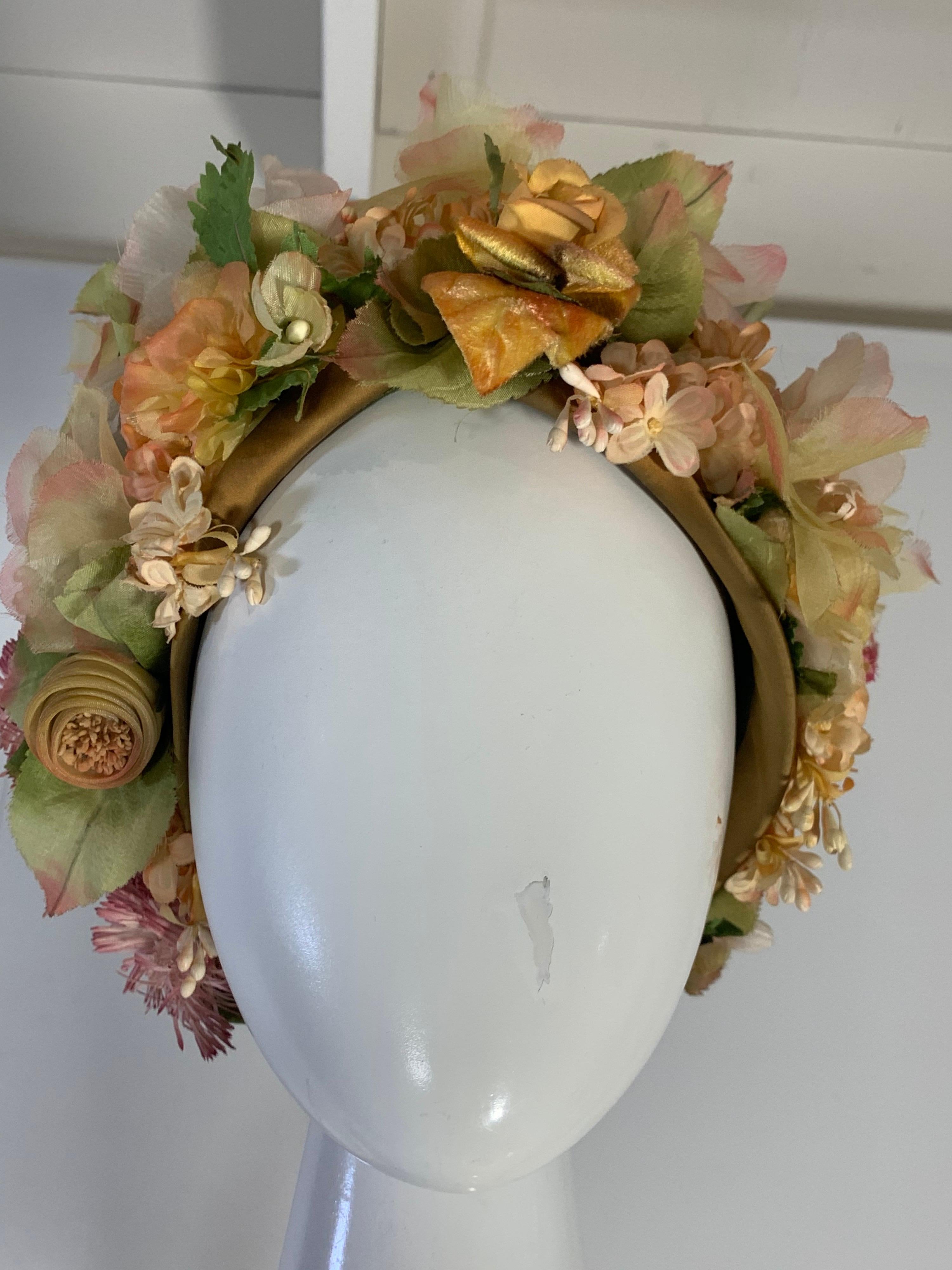 1960s Christian Dior silk spring floral turban hat by Marc Bohan for Dior. Beautiful muted florals and greenery are so delightful!  Mesh base fabric with satin edging. Size 22. Medium