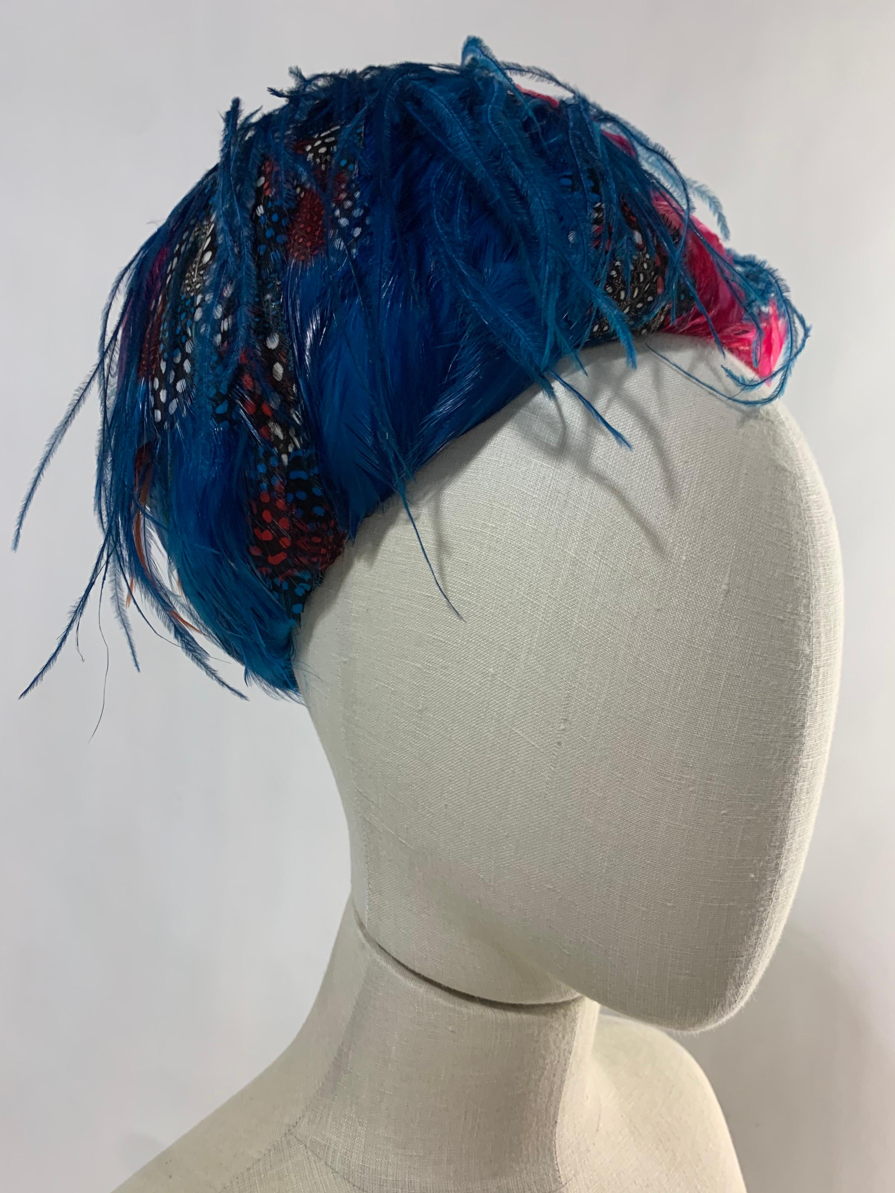 A beautiful 1960s Christian Dior turquoise ostrich and multicolor feather bubble-shaped hat. To be worn at crown of head and attached with combs or pins. Gorgeous! One size fits all.