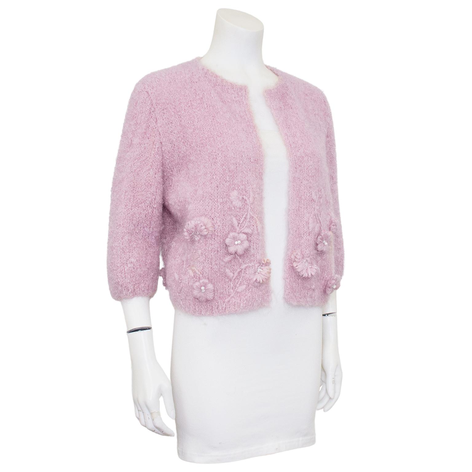 The perfect added touch for your summer cottons. 1960's custom knit mohair 3/4 sleeve bolero with trapunto floral embroidered details. This was an extremely skilled knitter who showcased her talents on this unique piece. In excellent condition,