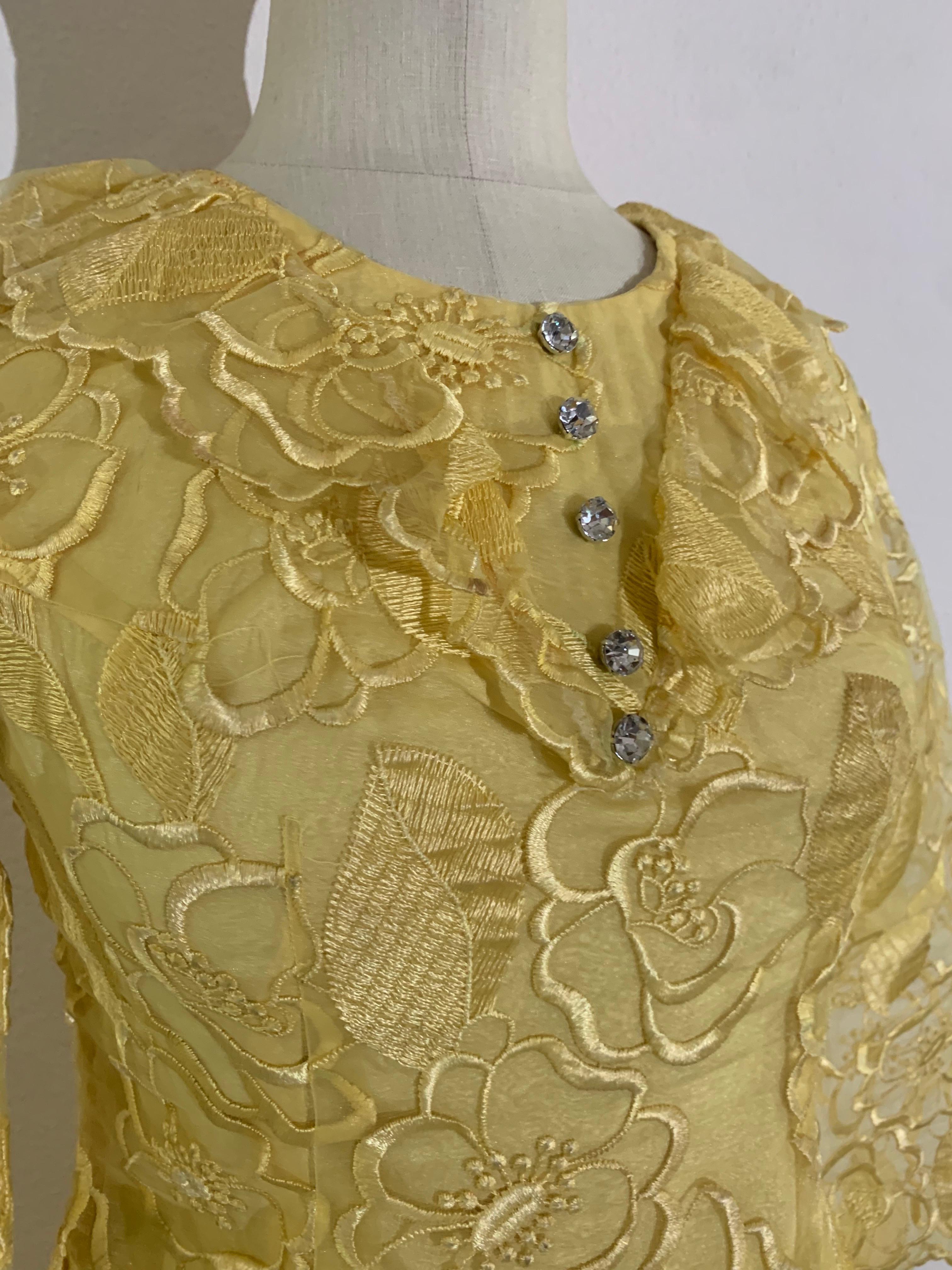 1960 Custom-Made Daffodil Yellow Embroidered Organza Mini Dress w Rhinestone Buttons: Fitted bodice with an A-line skirt, slightly flared sleeves, ruffled neckline. Fully lined in yellow taffeta. Back zipper. US size 6. 