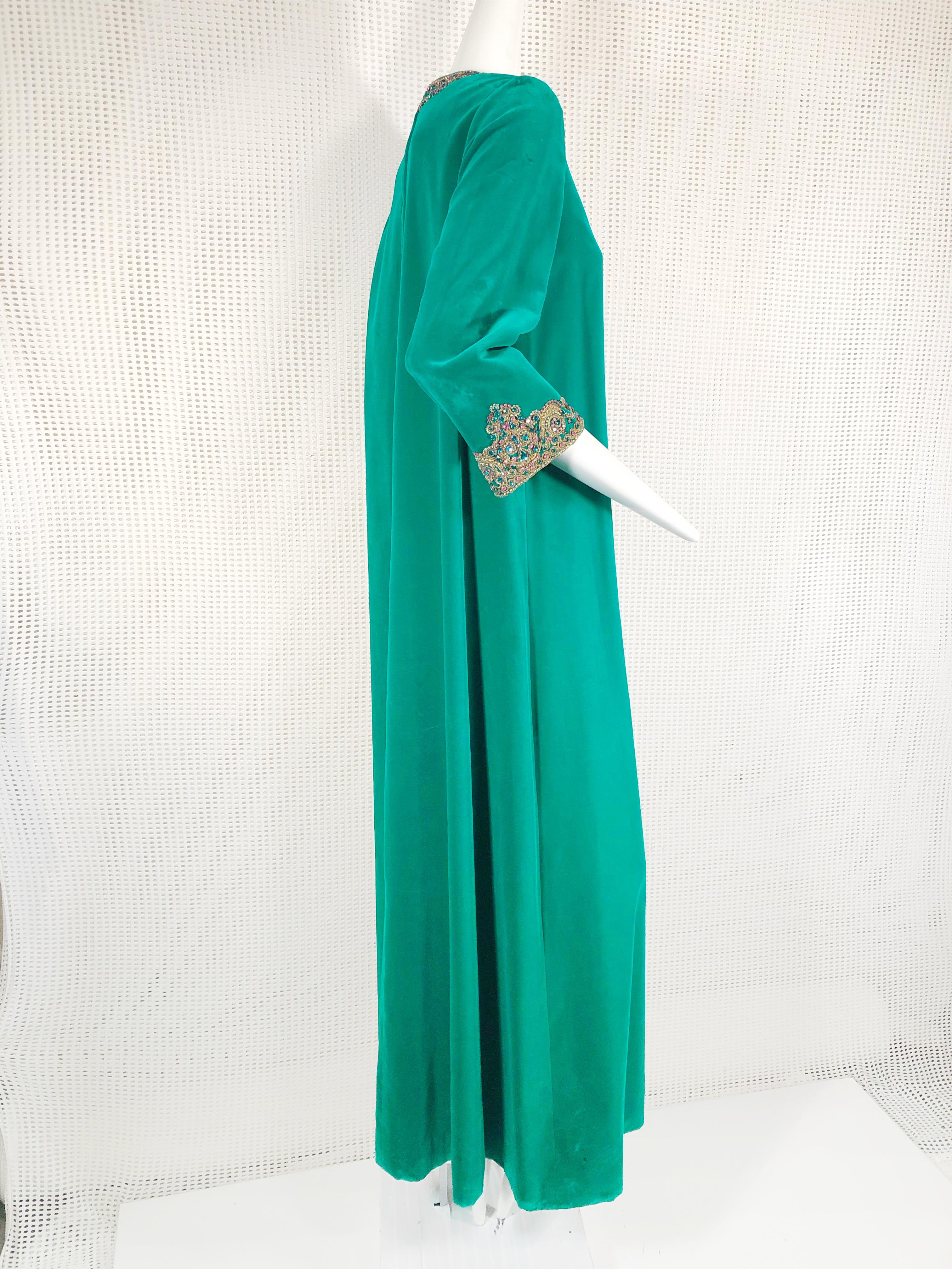 1960s Custom-made emerald green cotton velvet Mod caftan with jeweled and gold cord embroidered and rhinestone neckline and cuffs. Labeled Helft's. Size 6. 