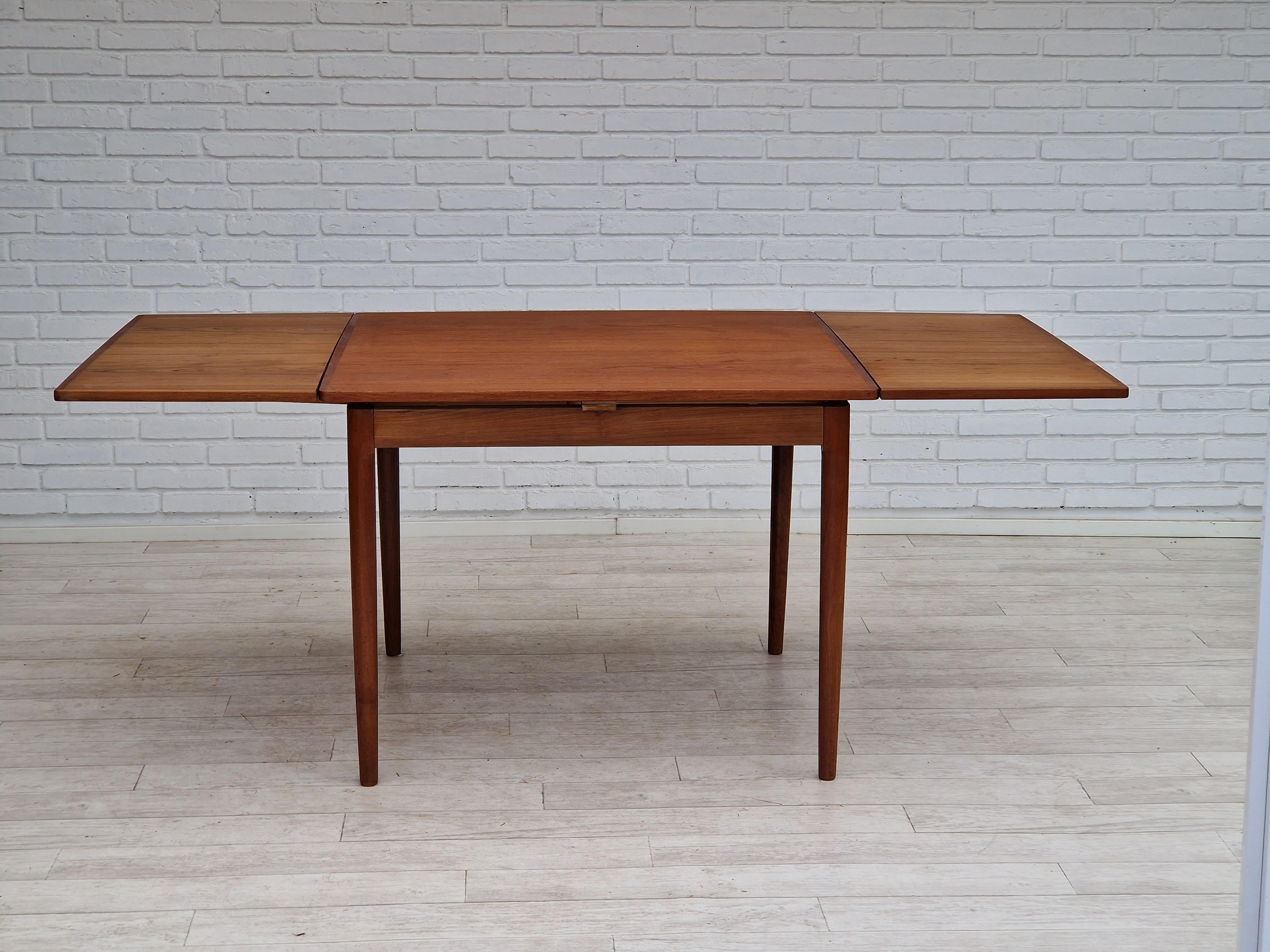 1960s, Danish design. Unfolded dining table in teak wood. Original very good condition: no smells and no stains.