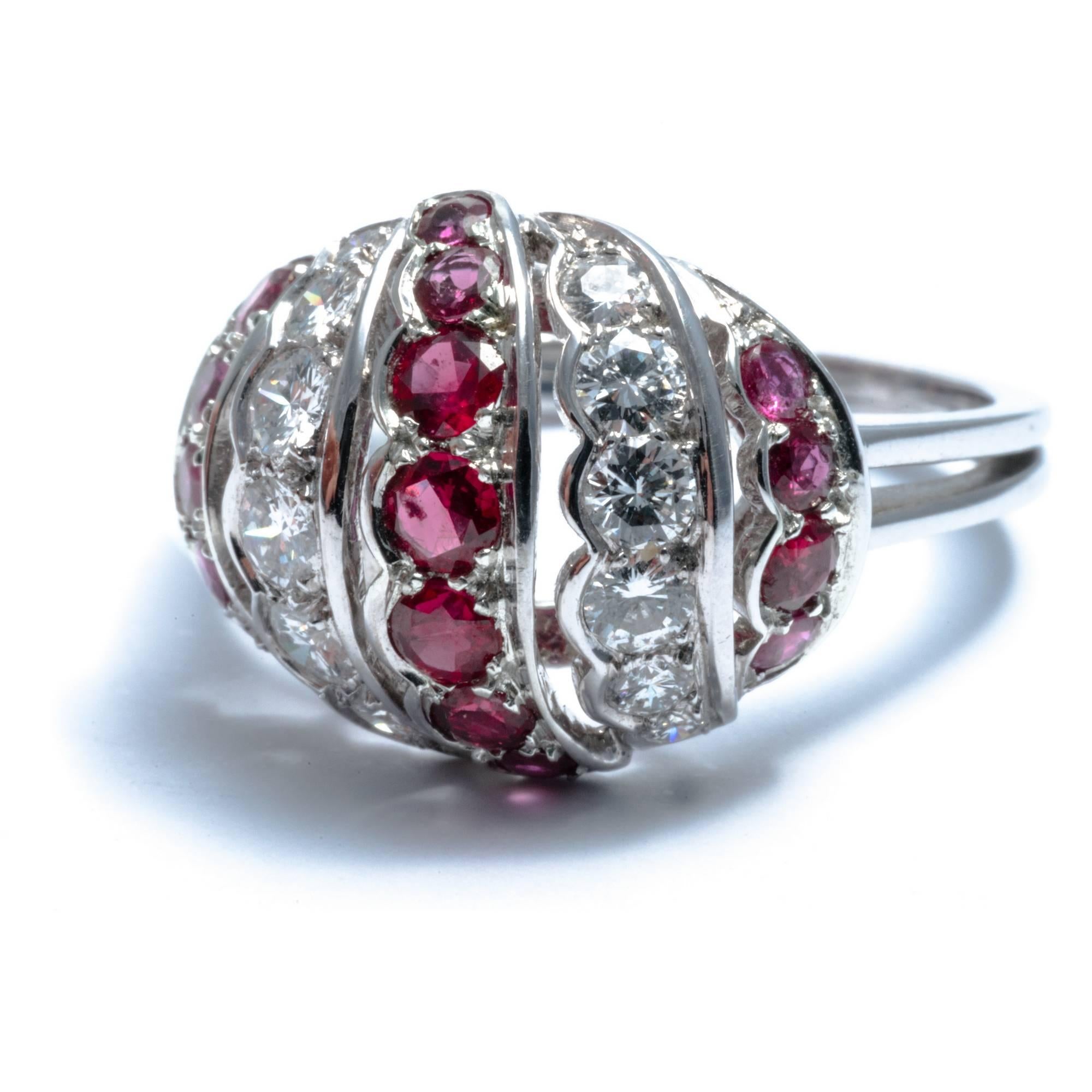  The  whimsical dome shape of this diamond and ruby cocktail ring features  5 sinuous rows of precious stones. Hand-crafted by Ansuini in white gold in 1950's,  approximate diamond total weight is carats 0.60;  approximate rubies total weight is