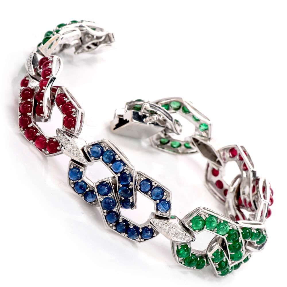 Wear all the “Big 3” infamous gemstones at once, with this Estate Diamond Sapphire Emerald & Ruby 18K Gold Chain Bracelet!  This bracelet is crafted in 18 karat white gold and displays a chain link design. 

There are round cabochons, prong set of