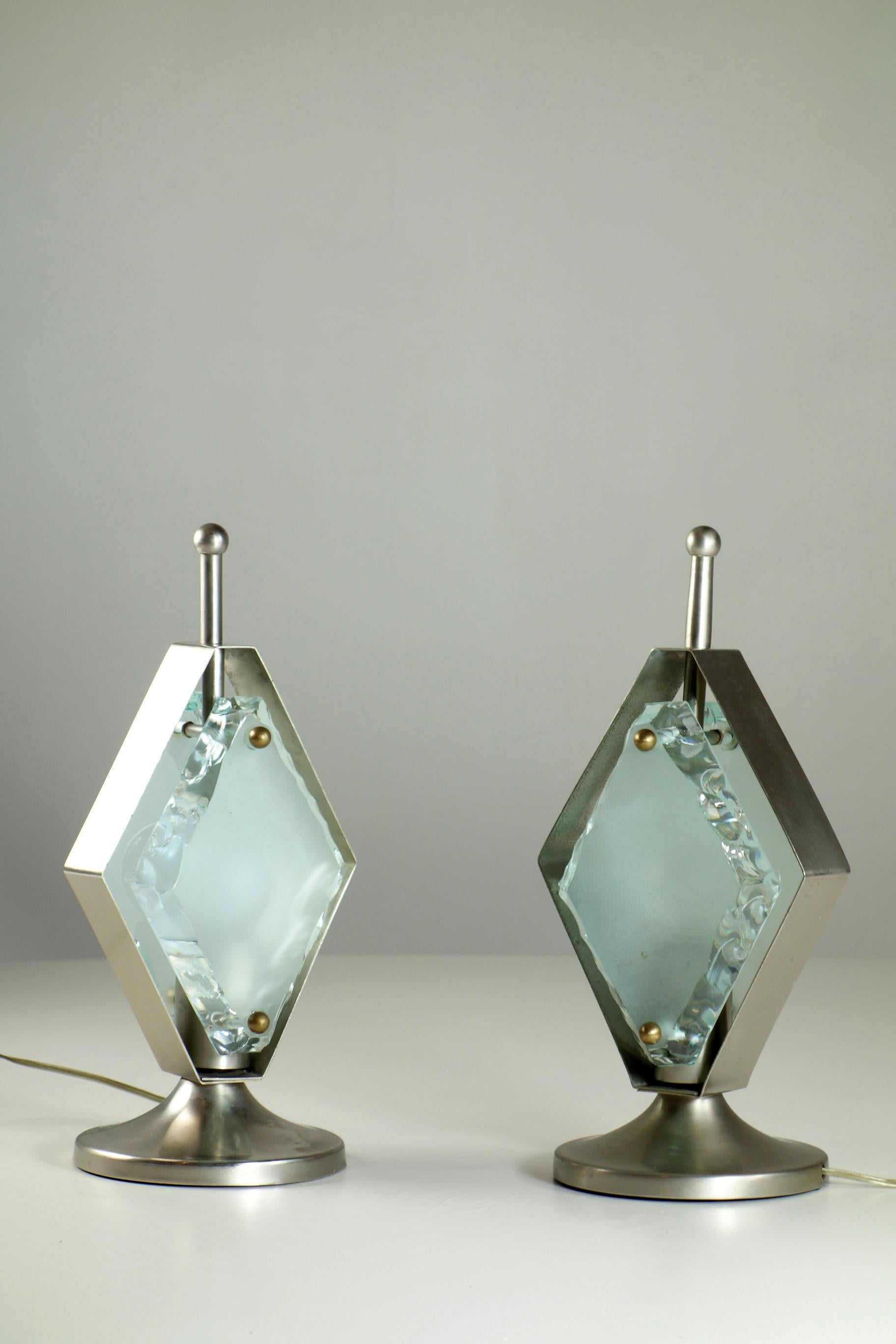 Pair of Table Lamps
Italy, 1960

Nickel Brass Frame and Cut Thick Crystal

Excellent Condiction (2 light chips imperceptible in the pictures)
Perfect working order