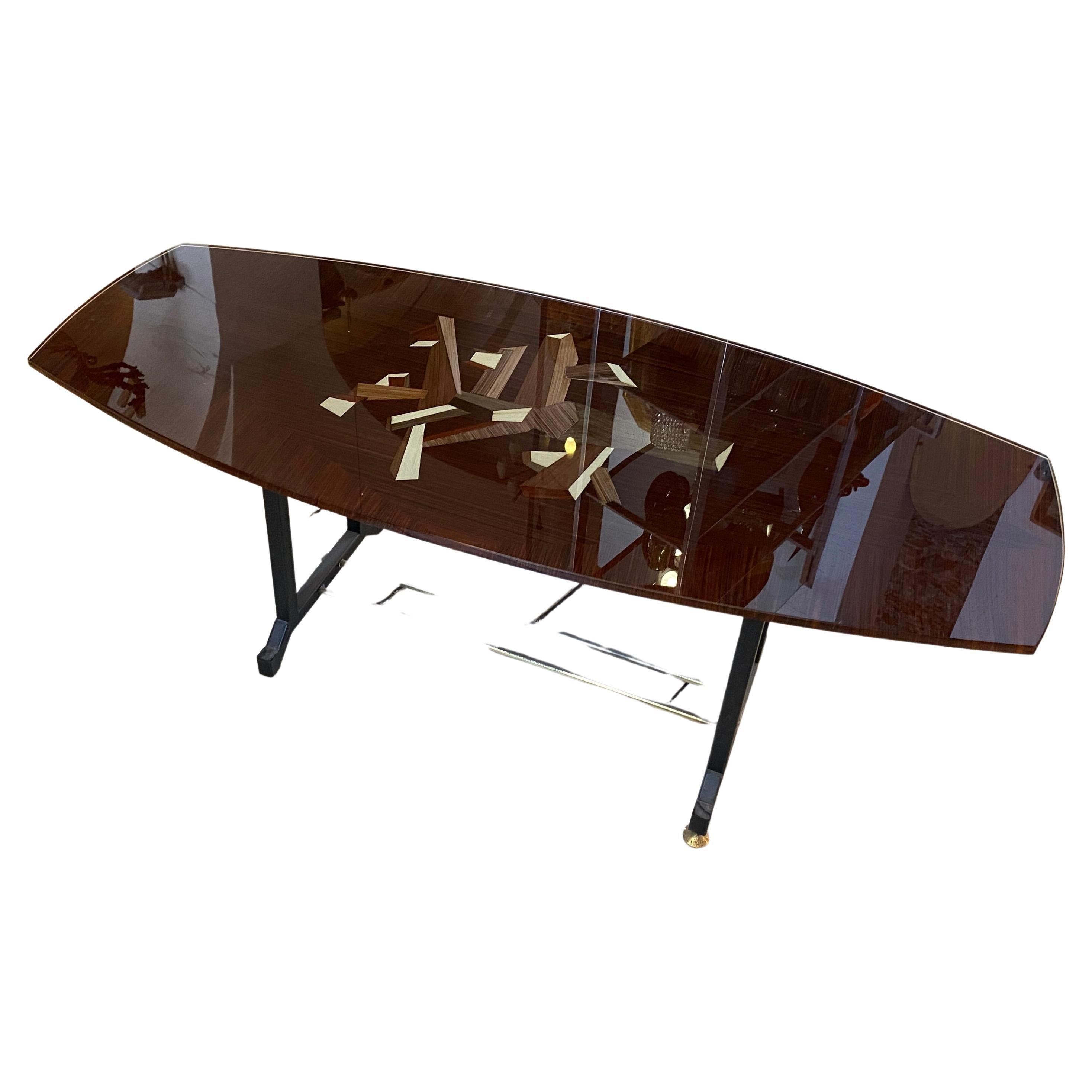 An amazing metal, brass and reverse painted heavy glass octagonal coffee table designed and manufactured in Italy in the style of Fontana Arte. The high quality reverse painting on the glass it's inspired by the metaphysical painting of Giorgio De