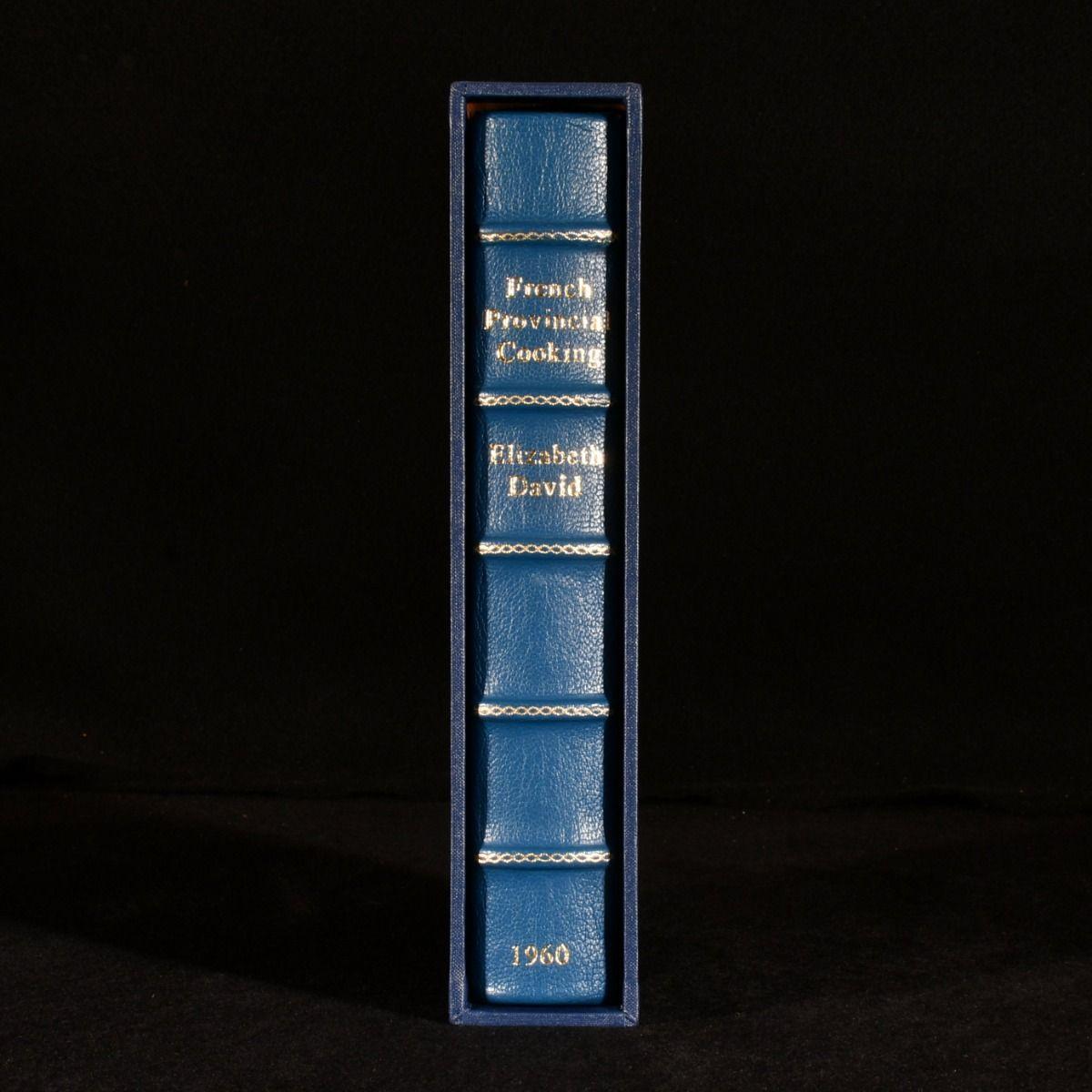 A beautifully bound first edition of this illustrated cookery book on French provincial cooking, housed in a slip case.

A first edition of the work, rebound in a beautiful dark blue, full morocco binding, with five raised bands and renewed marbled