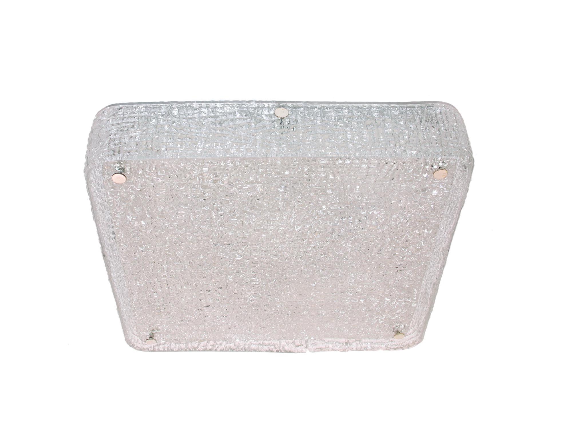 Gorgeous large two part rectangular-shaped flush mount ceiling light with one ring outside and a flat disc made of heavy textured clear iced glass on a white metal frame with nickel finals. Manufactured by Kaiser Lighting, Germany in the 1960s.