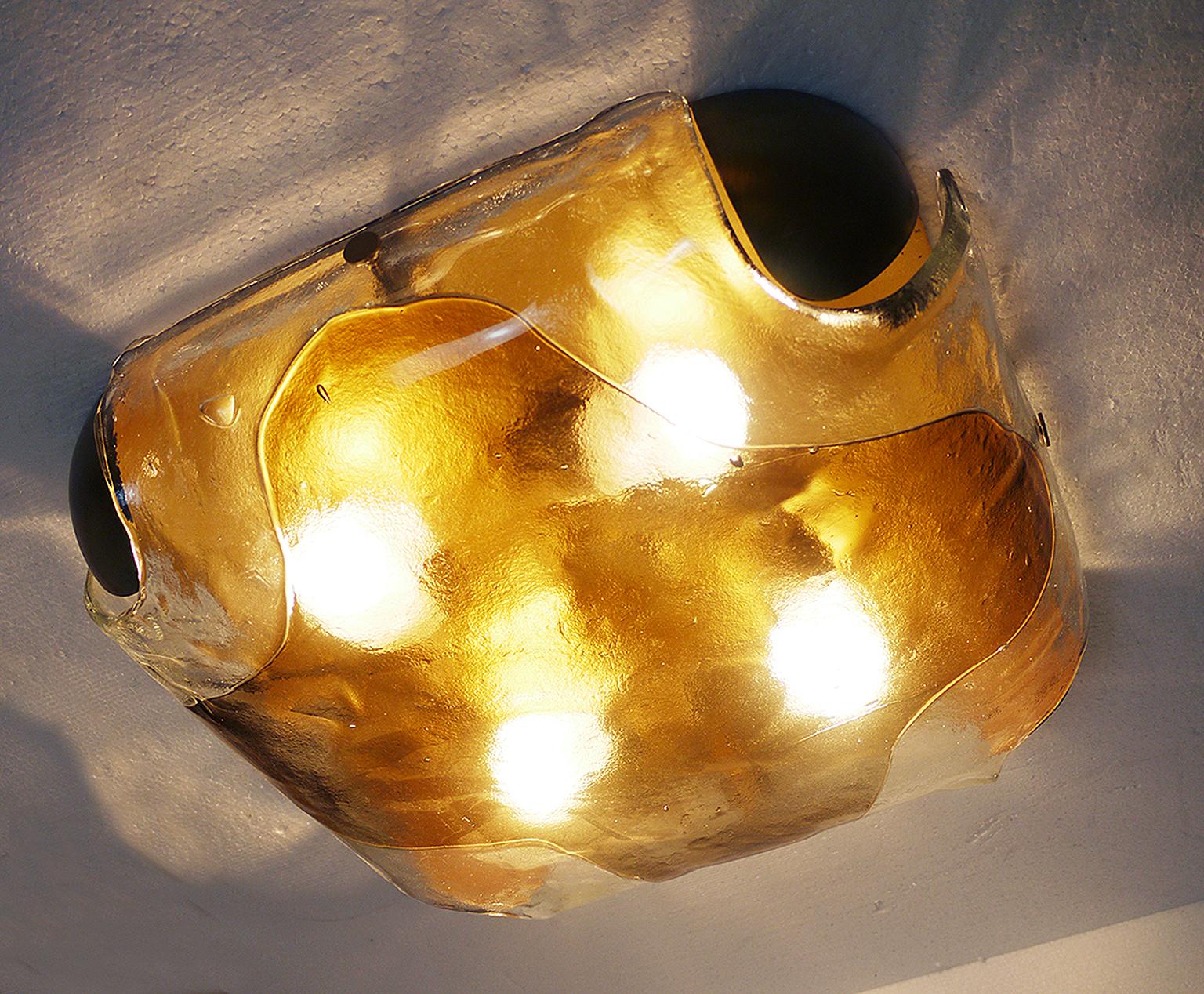 Elegant flush mount ceiling light executed in Murano glass on a brass frame with wooden finals. Made in the 1960s by Kaiser Leuchten, Germany. 

Lighting: takes four large Edison base screw bulbs. 
Condition: excellent vintage condition. No