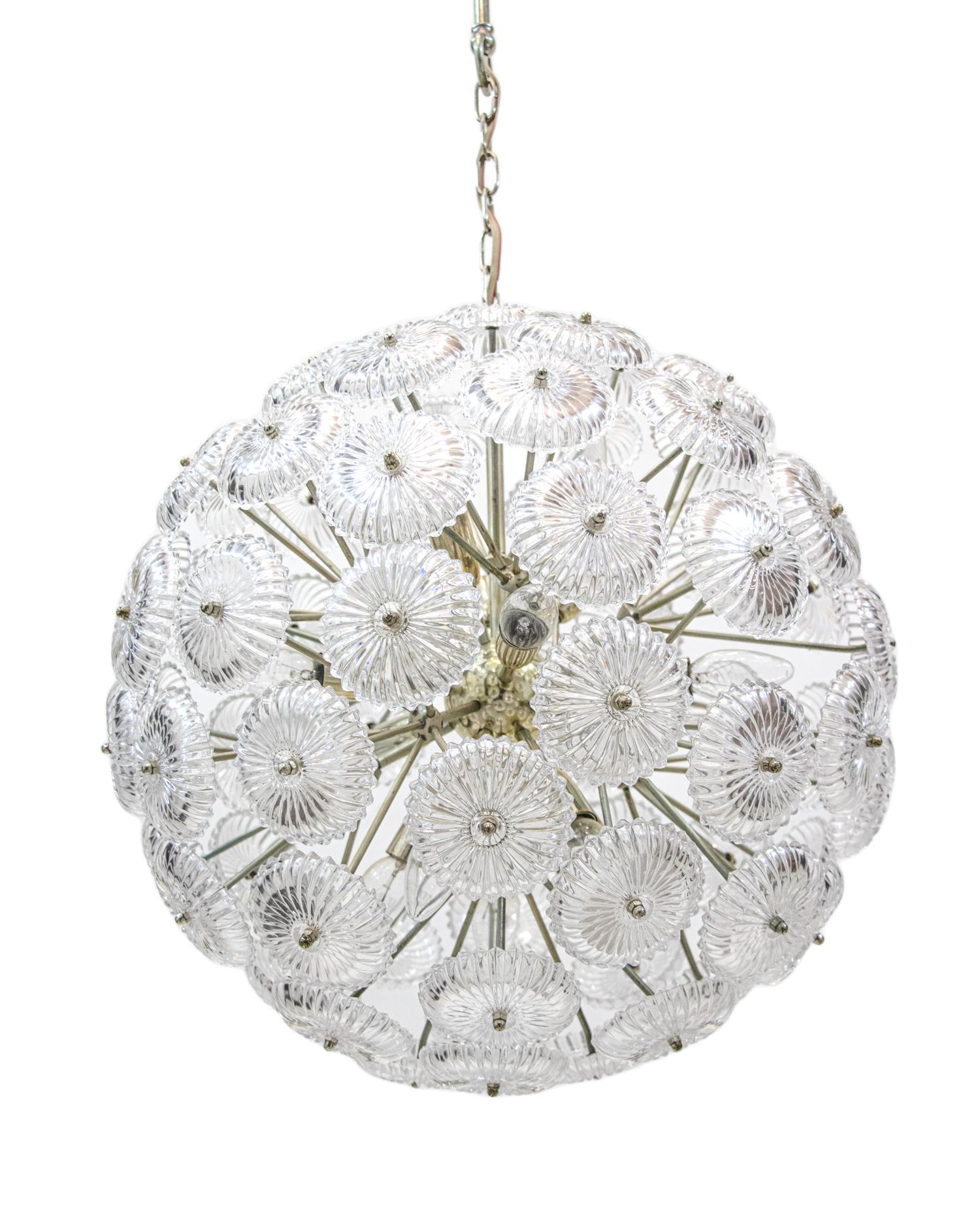 Glamorous snowball chandelier with crystal glass shades and a high quality nickel base. Chandelier illuminates beautifully and offers a lot of light. Gem from the time. With this light you make a clear statement in your interior design. A real