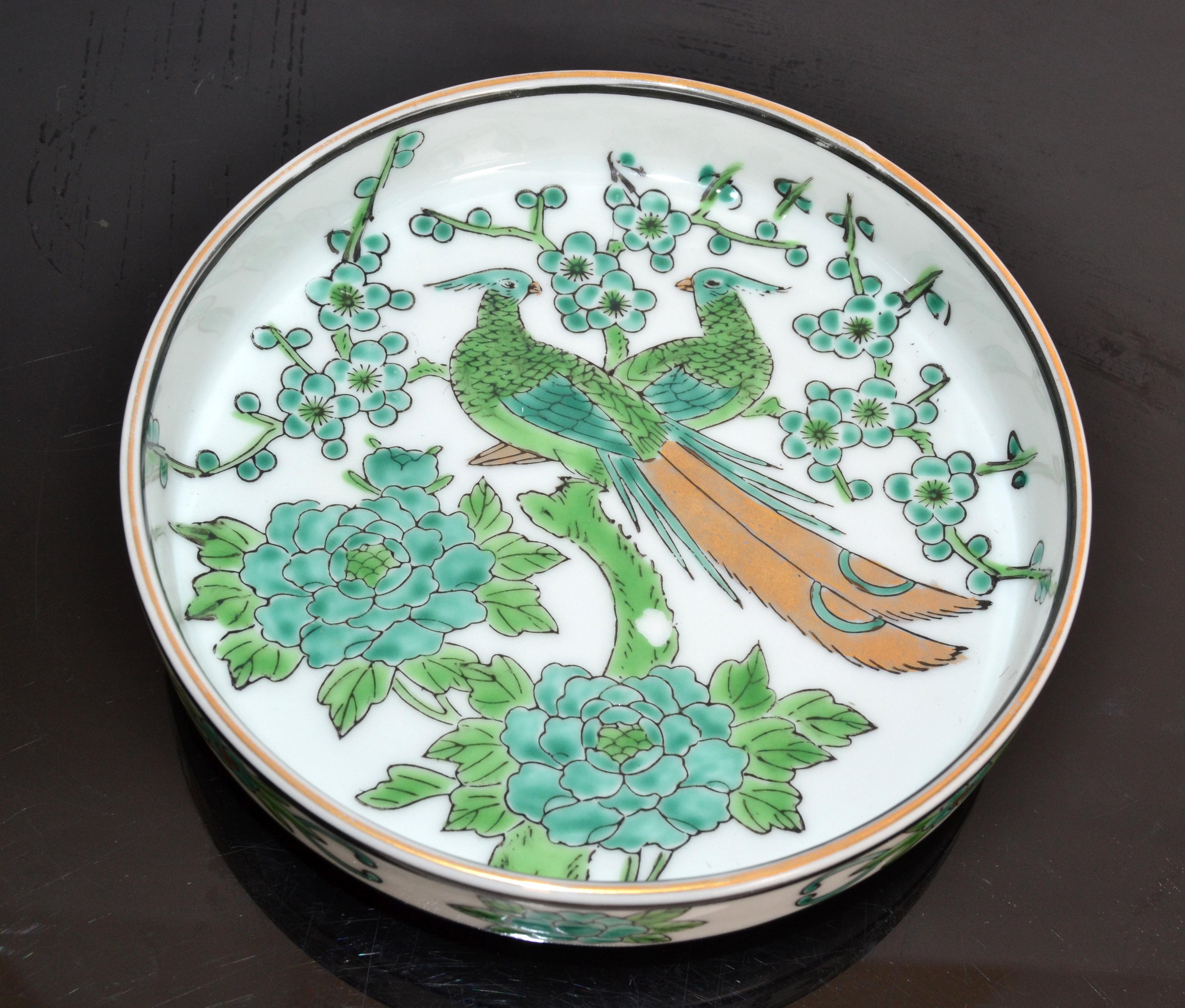 This is a beautiful circa 1960 Mid-Century Modern Gold Imari marked Porcelain hand-painted green, gold leaf and white bowl, vide poche, plate or dish.
The piece has a gorgeous peacock motif with gold leaf accents. 
Marked Gold Imari on bottom