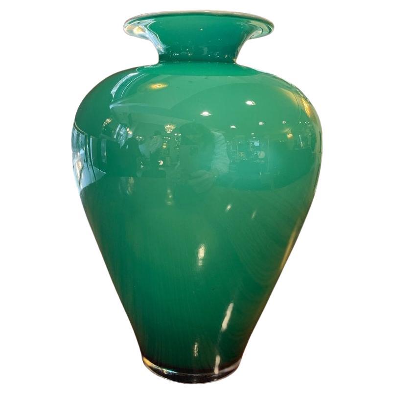 1960 Green glass vase with a milk glass interior in vendita