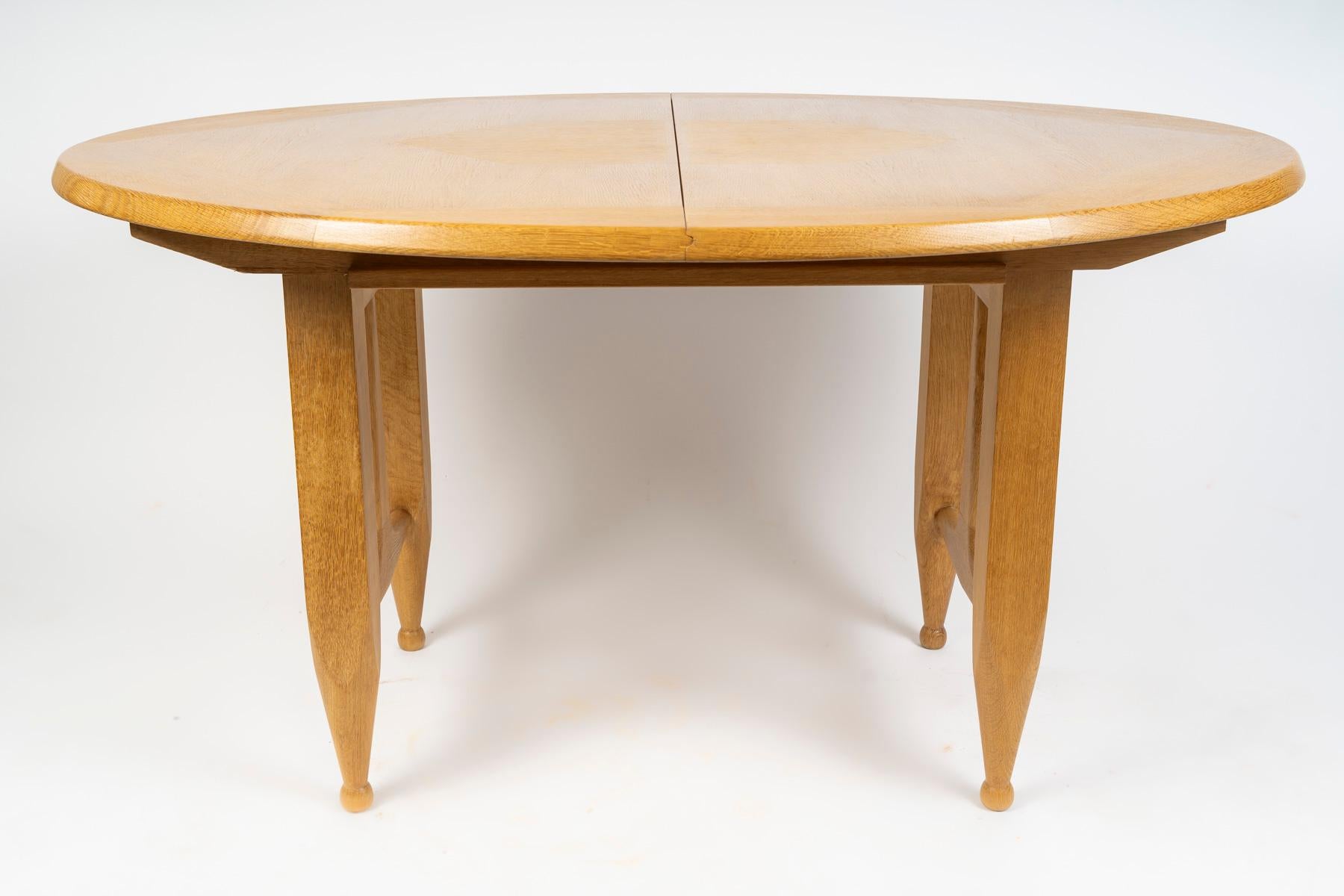 Guillerme and Chambron, oak table, 
Edition Votre Maison circa 1970 +2 extensions, each 35 cm. 

Dimensions with the 2 extensions: 73x208x106 cm

Composed of a tabletop made of solid blond oak assembled in a geometric pattern, resting on 4 legs with