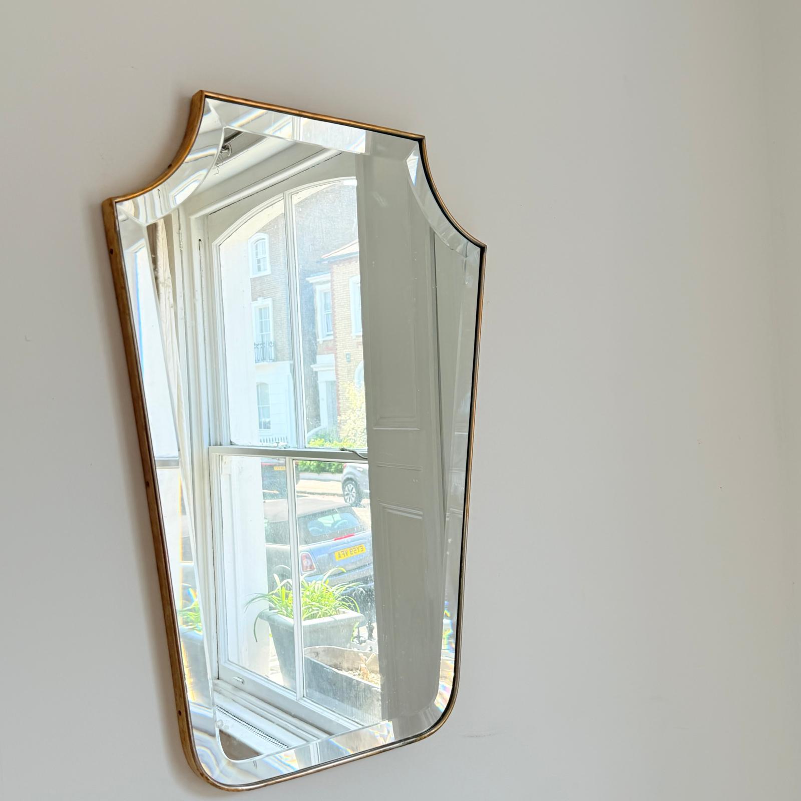 A 60's Italian beveled mirror in fine polisher brass frame