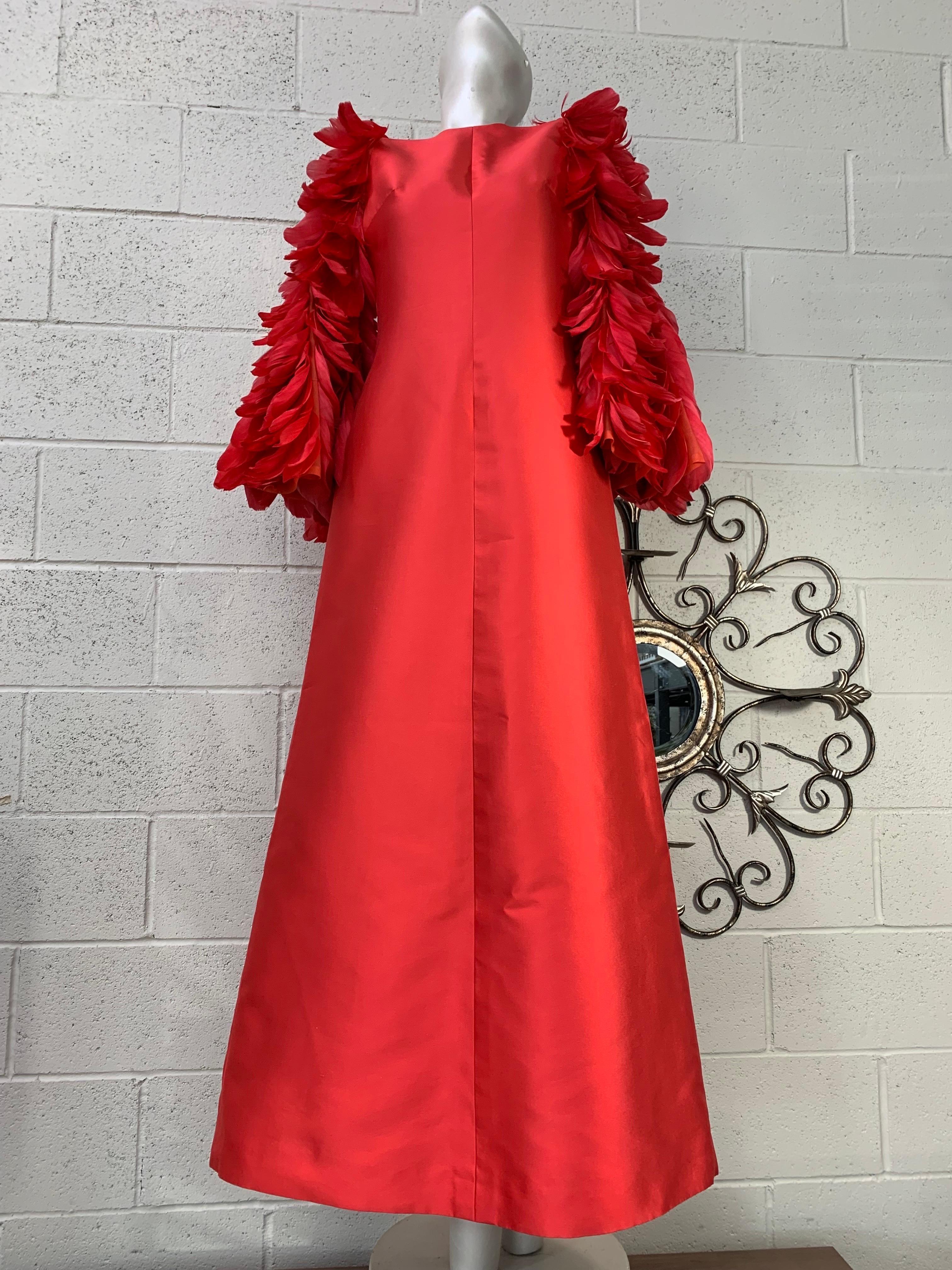 1960 Joui Schiesser Haute Couture Red Silk Gazar Gown w Feathered Bell Sleeves. A-line silhouette with rounded neckline and luxurious feather applique sleeves. Sleeves are an organza base providing movement. Back zipper closure. Fully lined. US size