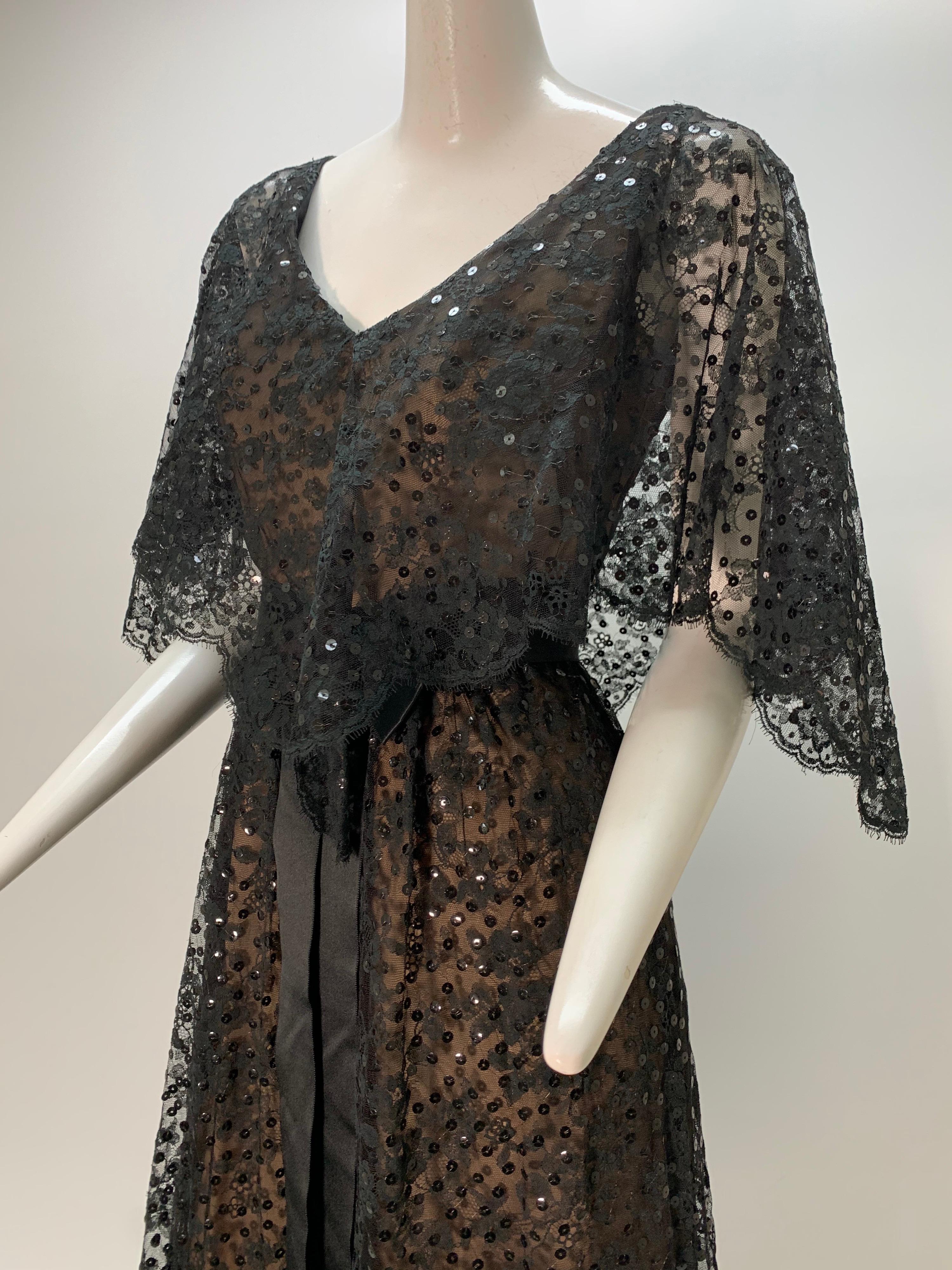 1960s Kiki Hart black lace and sequin nude illusion 1930s-inspired caplet gown with black silk satin ribbon belt. Fitted waist, fully lined.
 Fits up to a US size 6