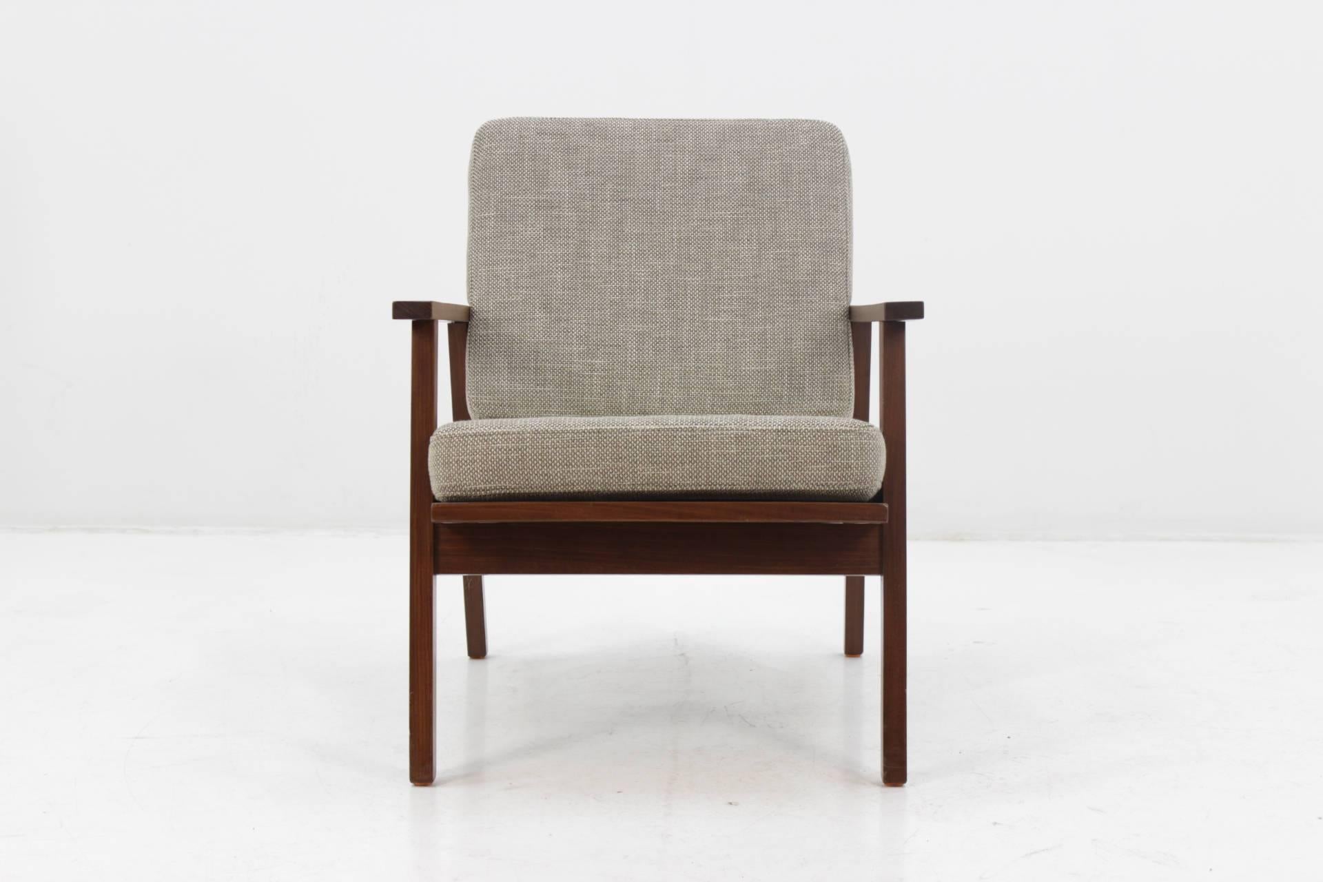 The chair features teak frame and new fabric upholstery .Item was carefully refurbished.