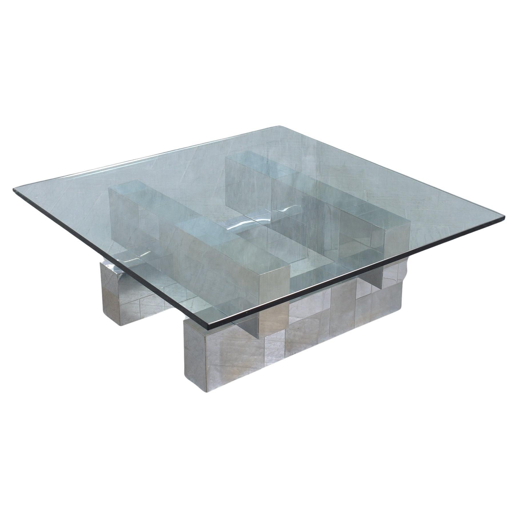 Discover the timeless allure of our Mid-Century Modern coffee table, a hallmark of the 1960s' avant-garde design reminiscent of the iconic Paul Evans. Crafted with precision, this table showcases a striking geometric base made from brushed steel and