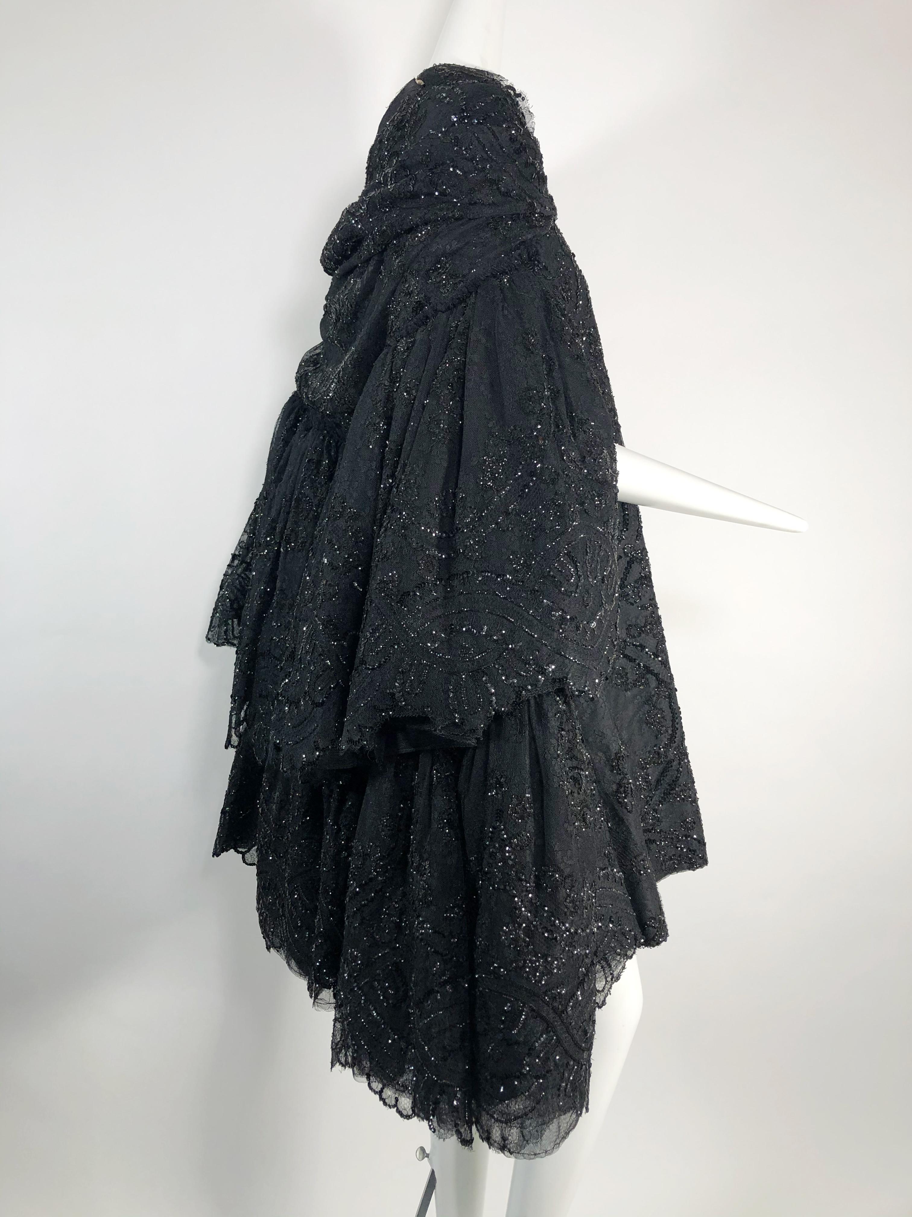 This extraordinary 1960 Italian couture layered horsehair lace net sequined cape is lavishly constructed by Pedro Rodriguez in his signature chic style, with very full silhouette cropped at the knee. Shawl collar hugs the shoulders. Made for singer,