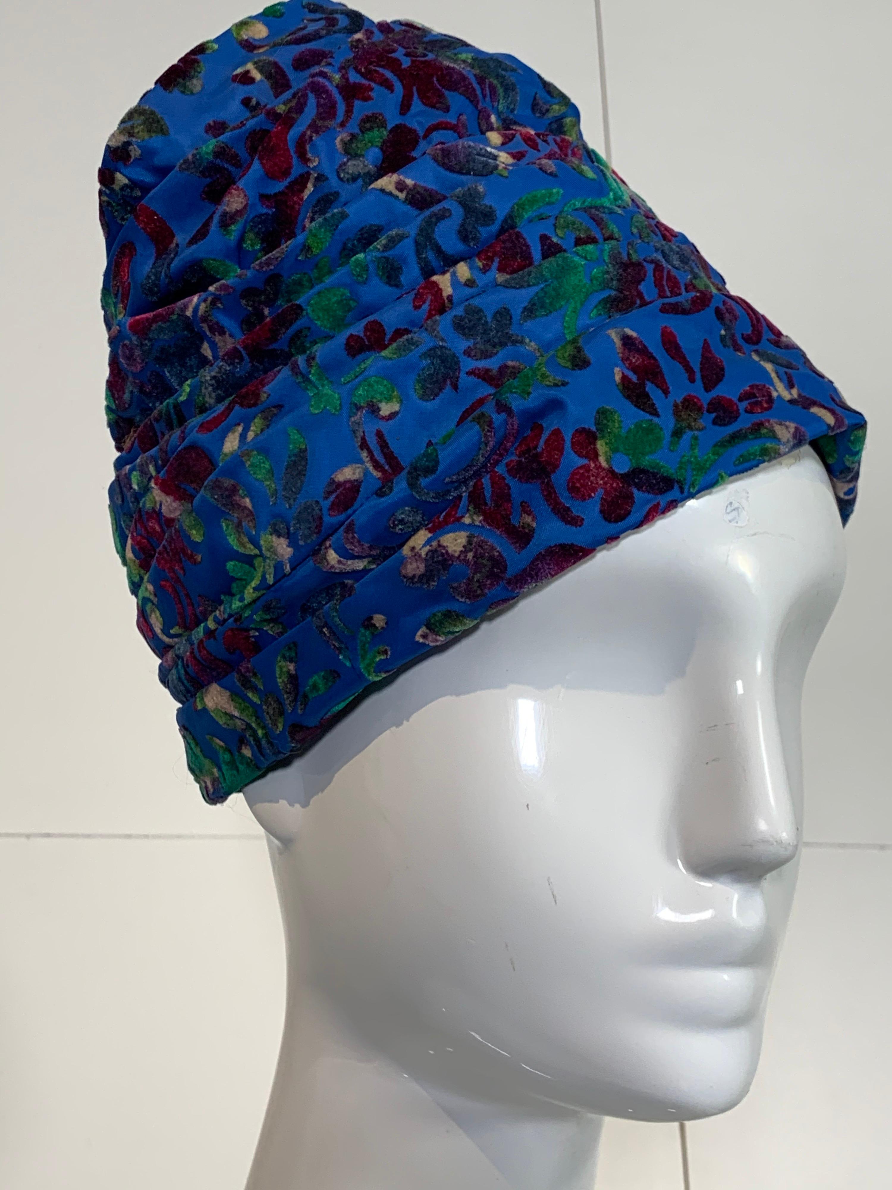 A beautiful 1960s Mr. John Jr. turban hat in a pleated cobalt blue base with figured multicolor velvet. Size medium.