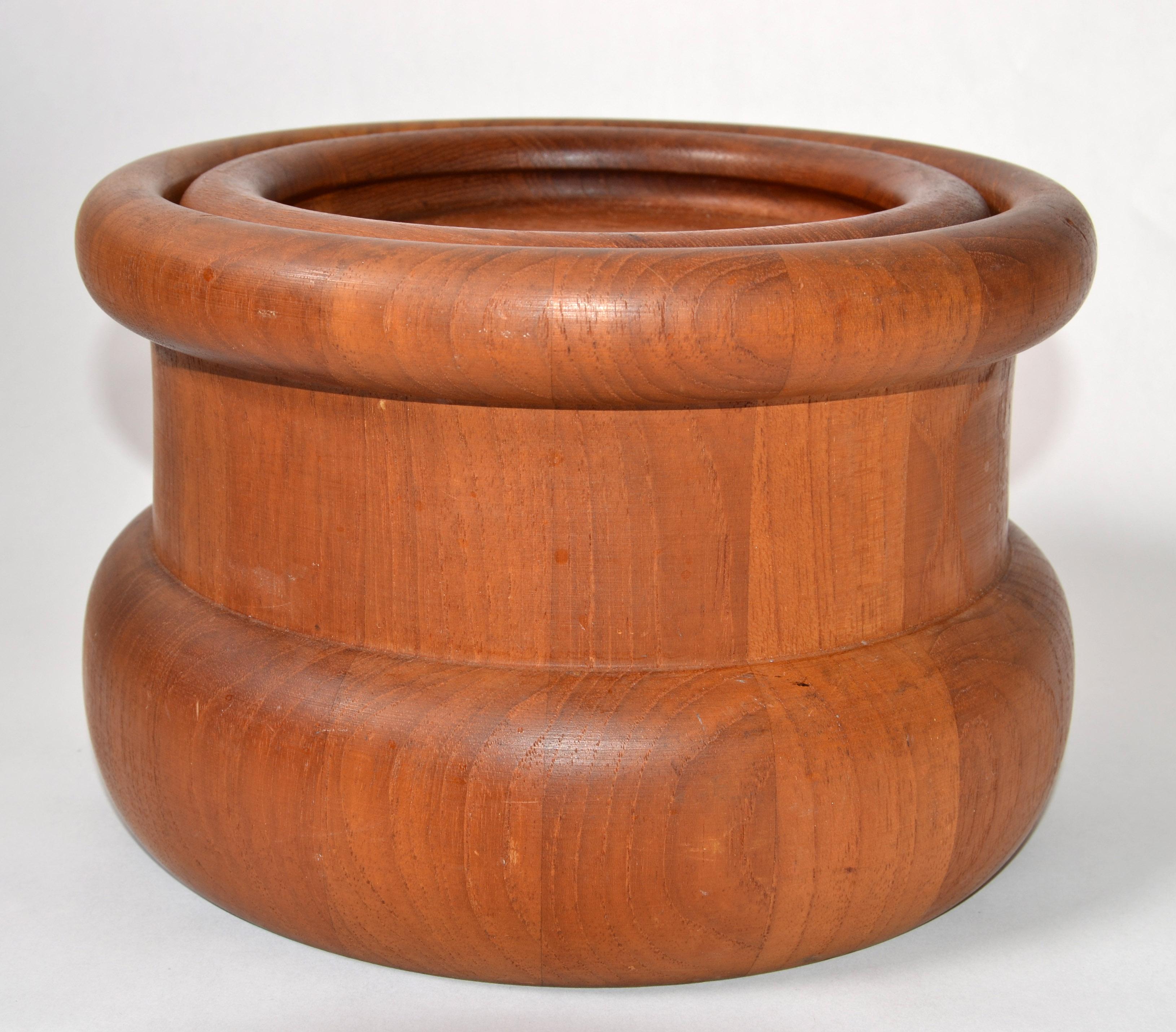 Danish modern handmade round teak lidded ice bucket made by Nissen in Denmark circa late 1960s. 
Stunner done the rolled wood Top and the interior is lined with black plastic to keep the ice cubes fresh for a long time.
Branded with the Nissen