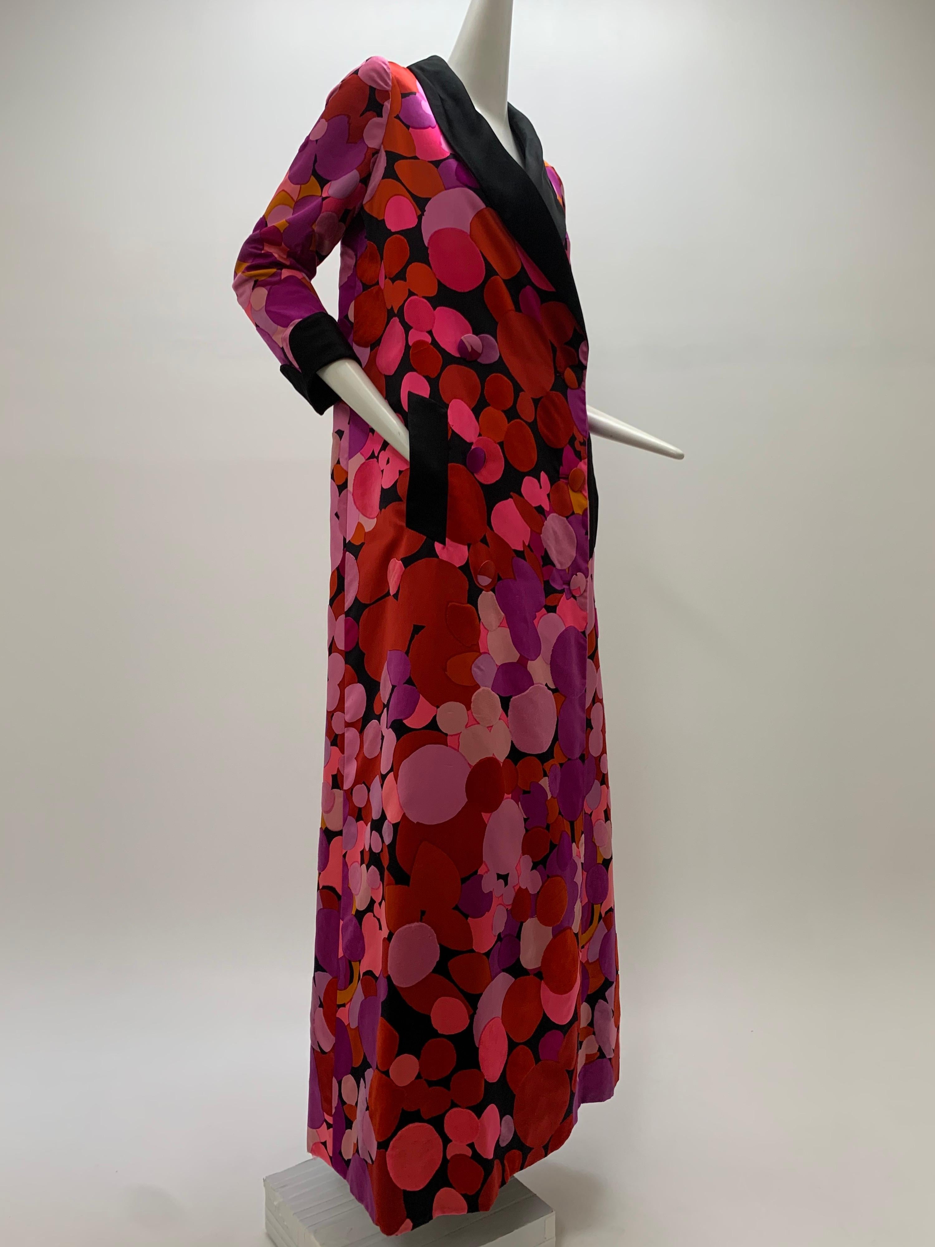 1960s Norman Norell silk satin opera coat/maxi coat with abstract polka-dot print and flocked velvet dots scattered throughout pattern. Fully lined in black silk and black collar, cuffs and pocket flaps.. Double breasted. Size 6