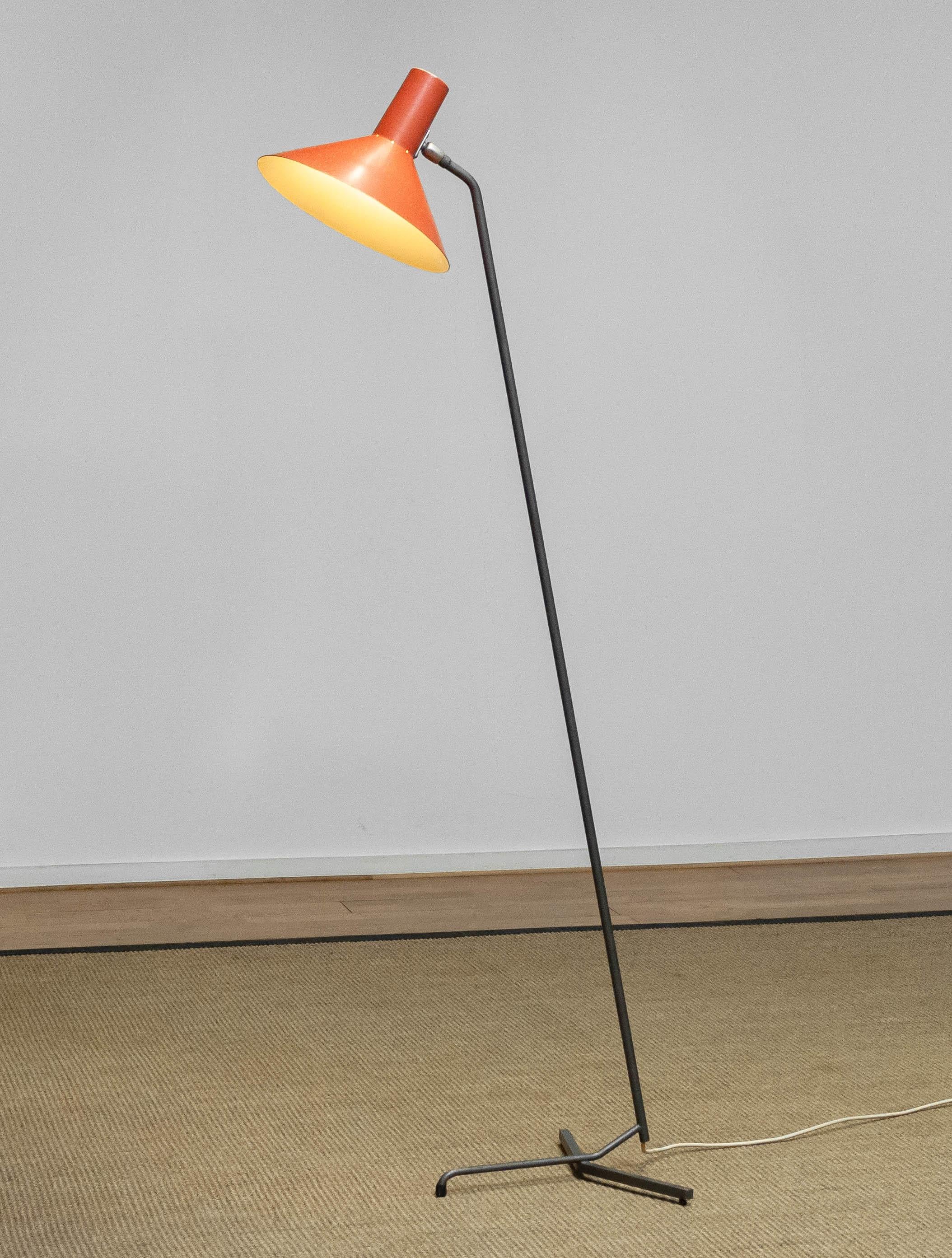 Beautiful Dutch 'Grasshopper' floor lamp with extremely rare base designed by J.J.M. Hoogervorst for Anvia. 
The base is made of steel and the orange lacquered shade is made of aluminum. Allover in good condition. The lacquered shade shows spots of