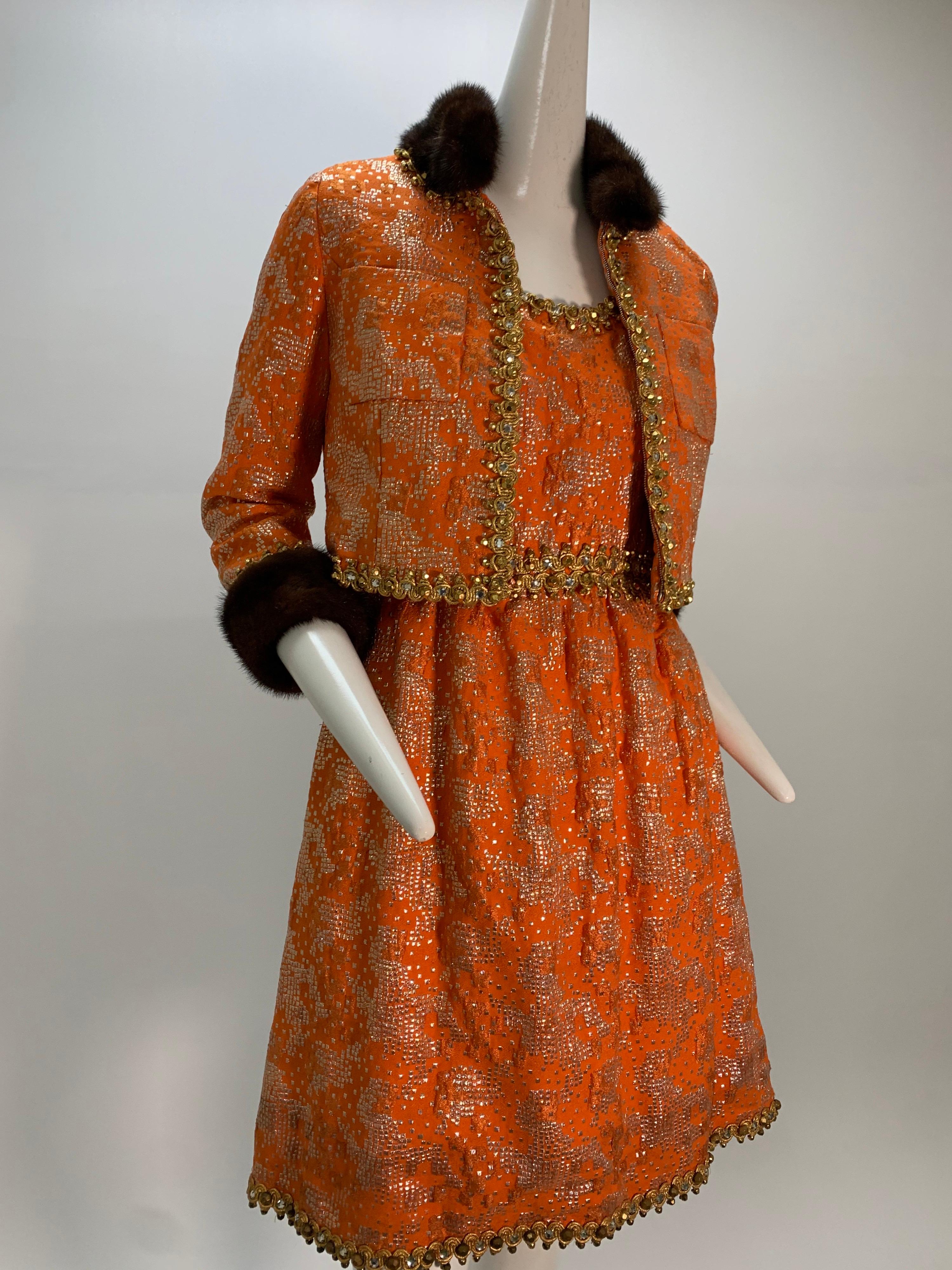 1960s Oscar De La Renta tangerine silk lame brocade cocktail dress and jacket ensemble: orange silk with silver lame square patterns scattered throughout a tank-style dress trimmed with gold braidwork at waist, and neckline and hem. The waist length