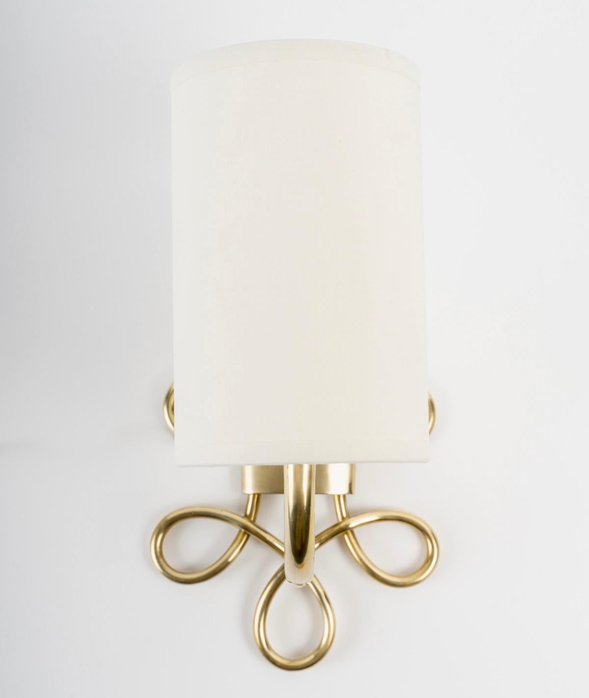 Brass 1960 Pair of “Boucle” wall lights in gilded brass Maison Honoré For Sale