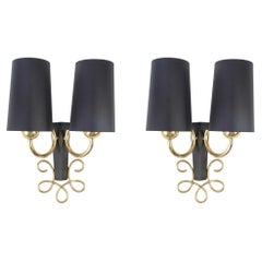 1960 Pair of “Boucle” wall lights in golden brass and wrought iron Maison Honoré