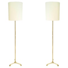 1960 Pair of bronze and brass floor lamps by Maison Bagués