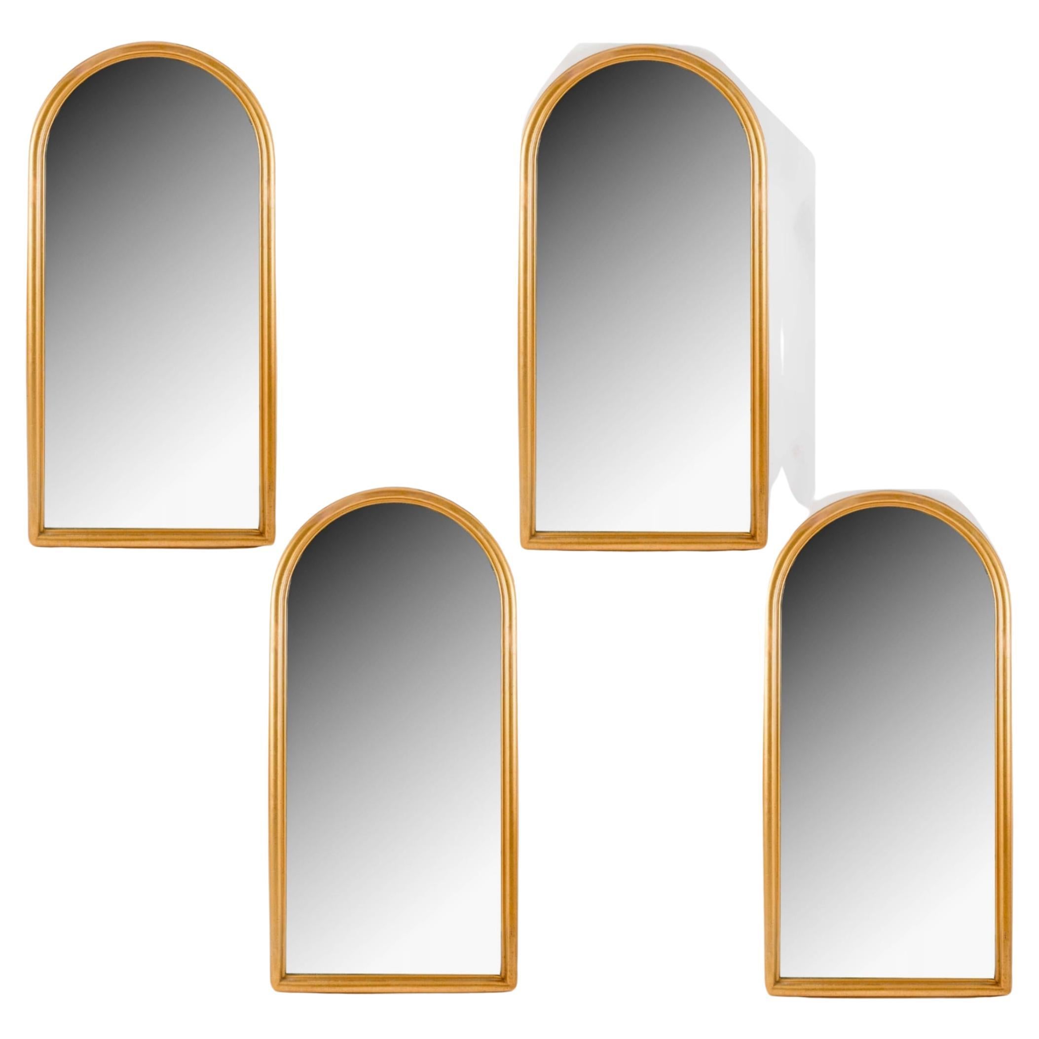 1960 Pair of molded and gilded wood mirrors inspired by a Romanesque ogive. 2