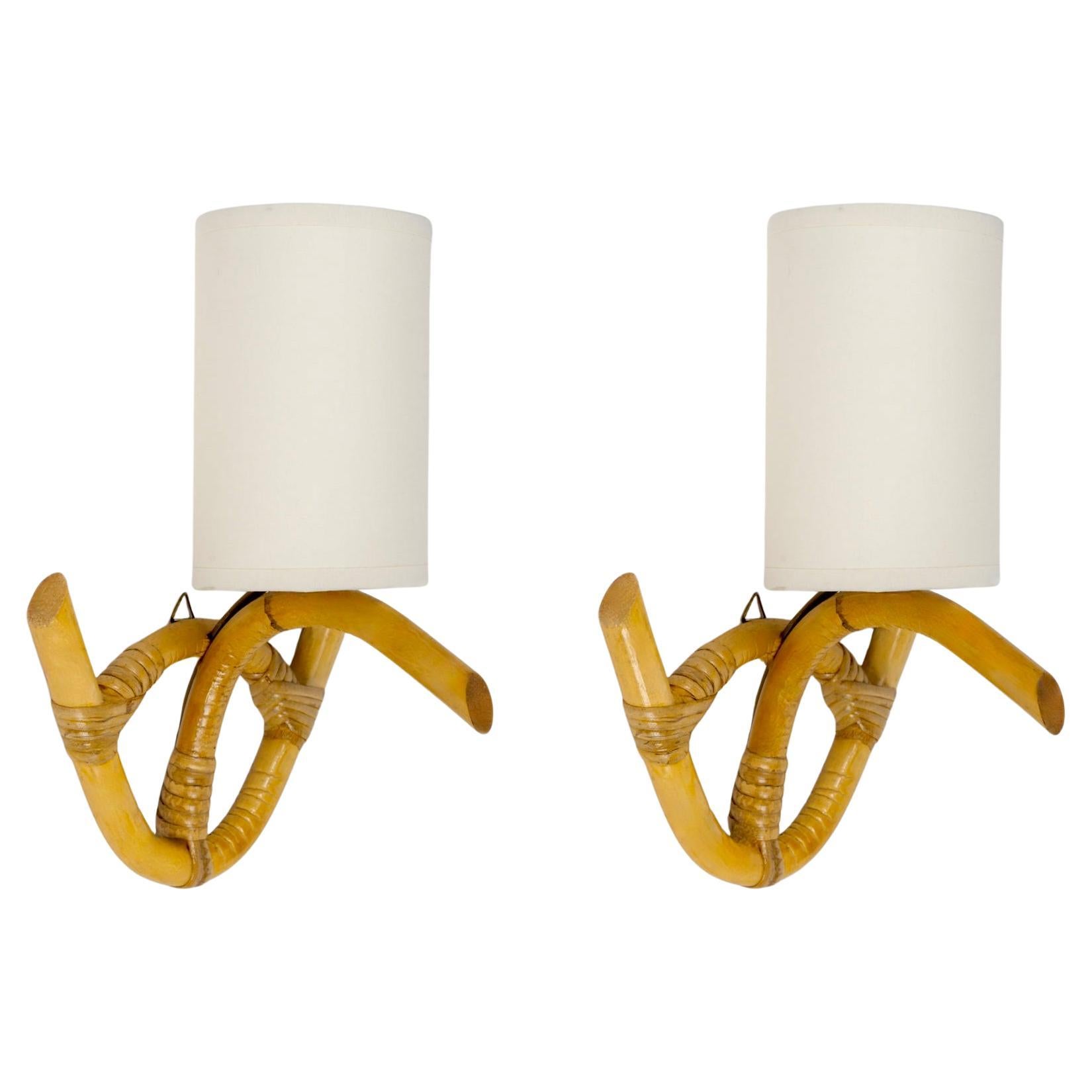 1960  Pair of rattan sconces by Louis Sognot