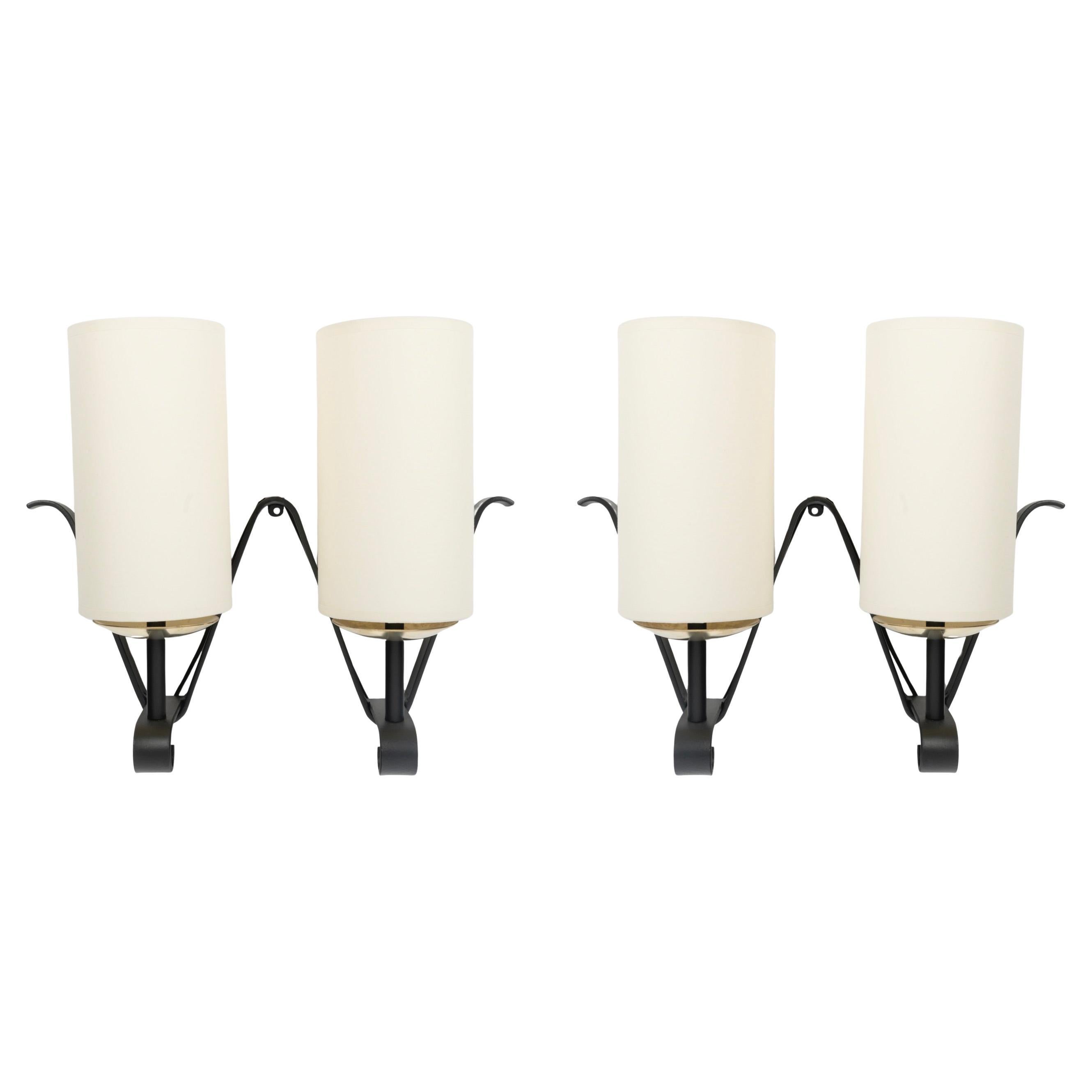 1960 Paire d
appliques murales en fer forgé Maison Bataillard en vente