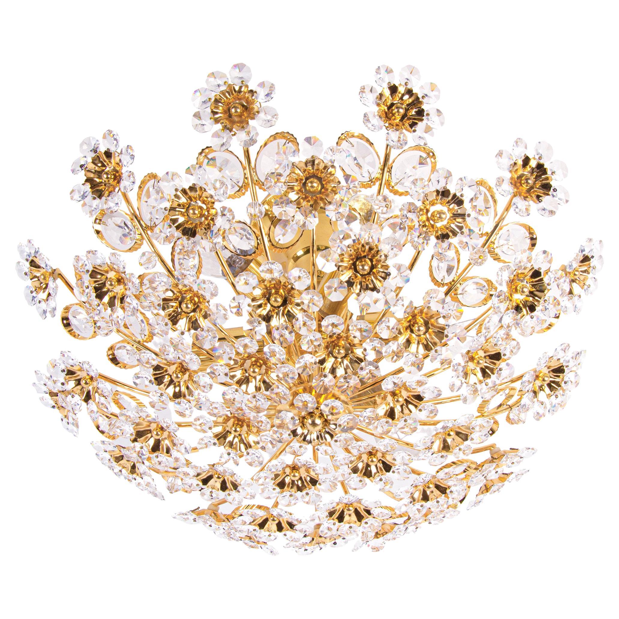 Elegant semi flush mount chandelier with a gold-plated brass frame and Swarovski crystals. These lamps have an incomparable unique character. A touch of luxury fills the room. Manufactured by Palwa, Germany in the 1960s. 
 
Manufacturer: Palwa,