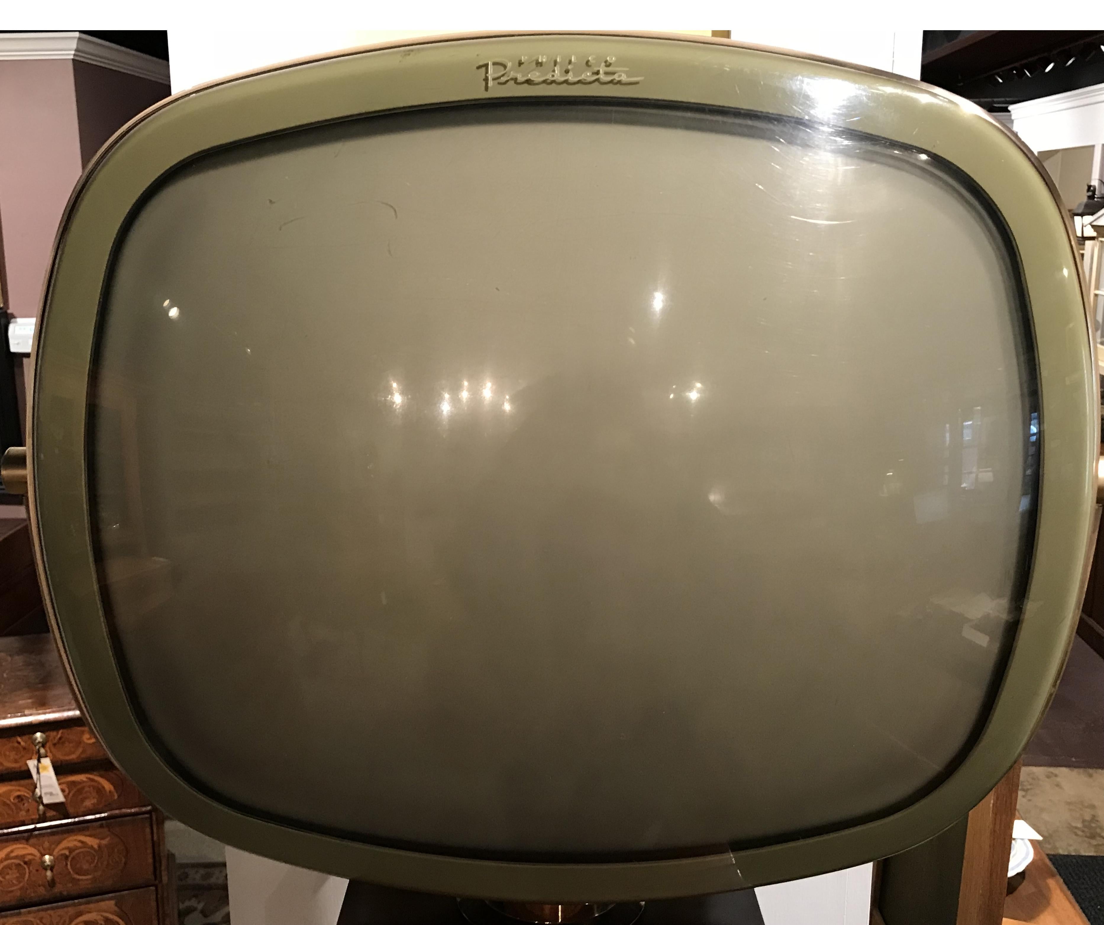 A rare exceptional example of a 1960 Philco Predicta Continental Model 4730 swivel screen television TV with a mahogany console, uniquely combining a Danish Modern and Space Age, Atomic look. It has a slim SF Philco 21 inch screen in safety case