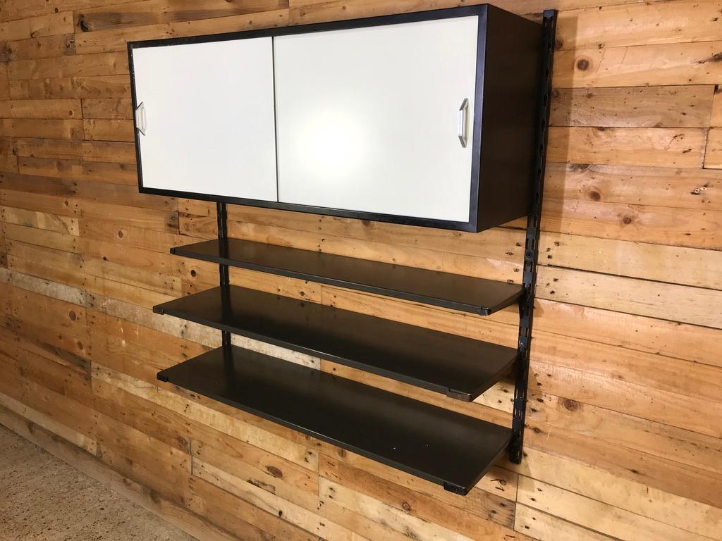 1960 Pilastro Tomado retro Industrial wall unit with 3 shelves a large cupboard and shelf with sliding doors, designed by Tjerk Reijenga for Tomado, Holland. The wall unit is in very good vintage condition. It had scratches, spots, little damage,
