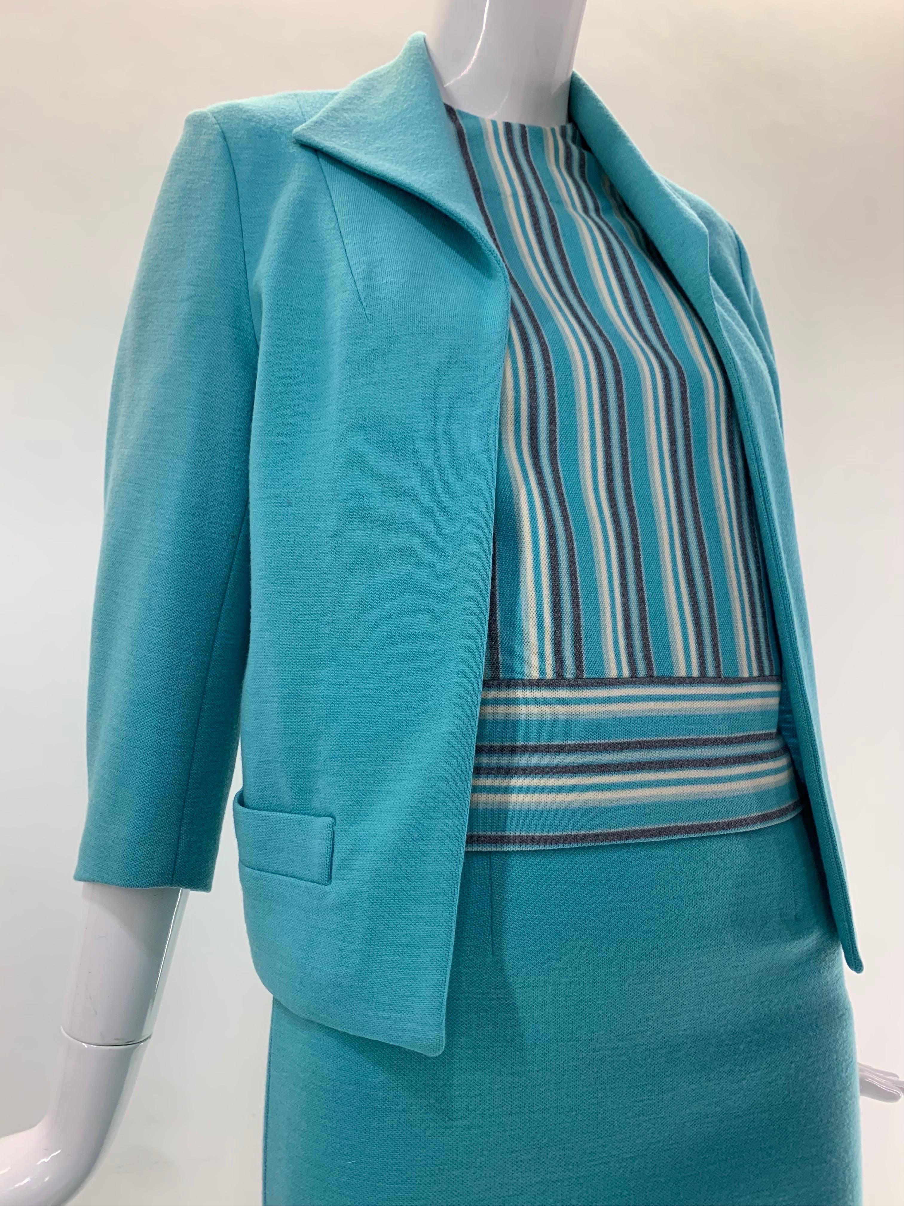 A smart and tidy 1960s Promenade - Holland turquoise wool double knit 3-piece skirt suit: Jacket and skirt in matching solid hue, blouse is a flattering narrow vertical stripe. Jacket is simply styled with single-point collar and no closures. Size 6.