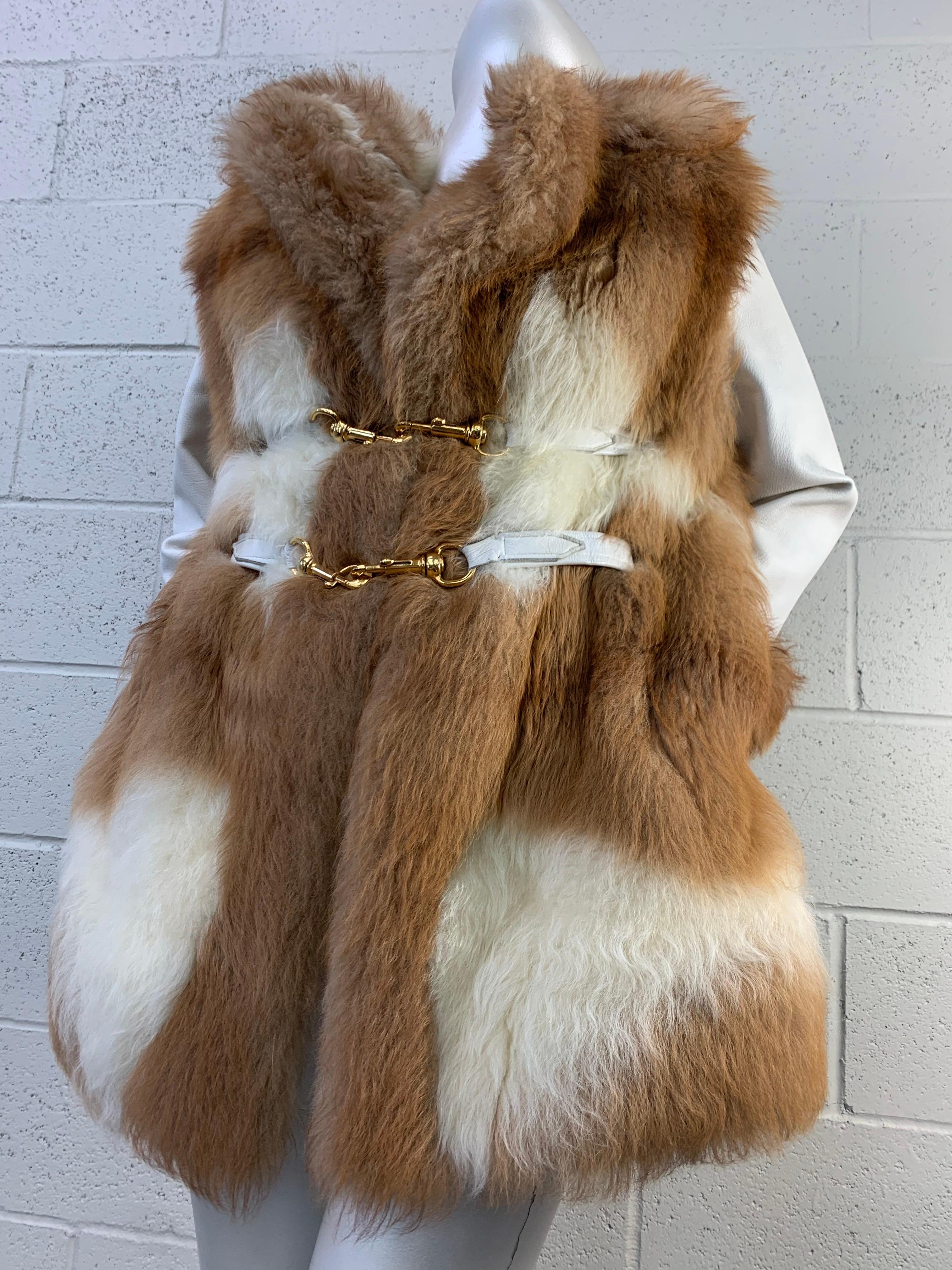 1960s Super-rare Mod-styled natural vicuna fur coat jacket with white leather sleeves. Collar and sleeves are trimmed in vicuna also. Vicuna is one of the costliest fibers in the world and is incredibly soft. You won't see this stunning arrangement