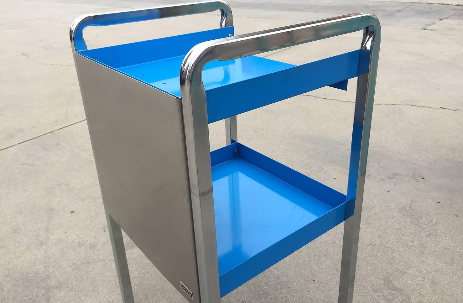 Retro steel medical cart refinished in high gloss powder coated blue and stainless steel. Put this unique piece to use as a bar cart, bathroom storage solution or nightstand, it’s versatile and quality-made. Excellent refinished